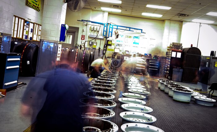 Members of the 437th Aircraft Maintenance Squadron line up parts to a C-17 Globemaster III tire, lay out bolts, and prepare to reassemble the aircraft parts May 14, 2013, at Joint Base Charleston – Air Base, S.C. The 437th AMXS Repair and Reclamation shop is trained and equipped to be dispatched on short notice to crash sites for aircraft recovery. (U.S. Air Force photo / Airman 1st Class Tom Brading)