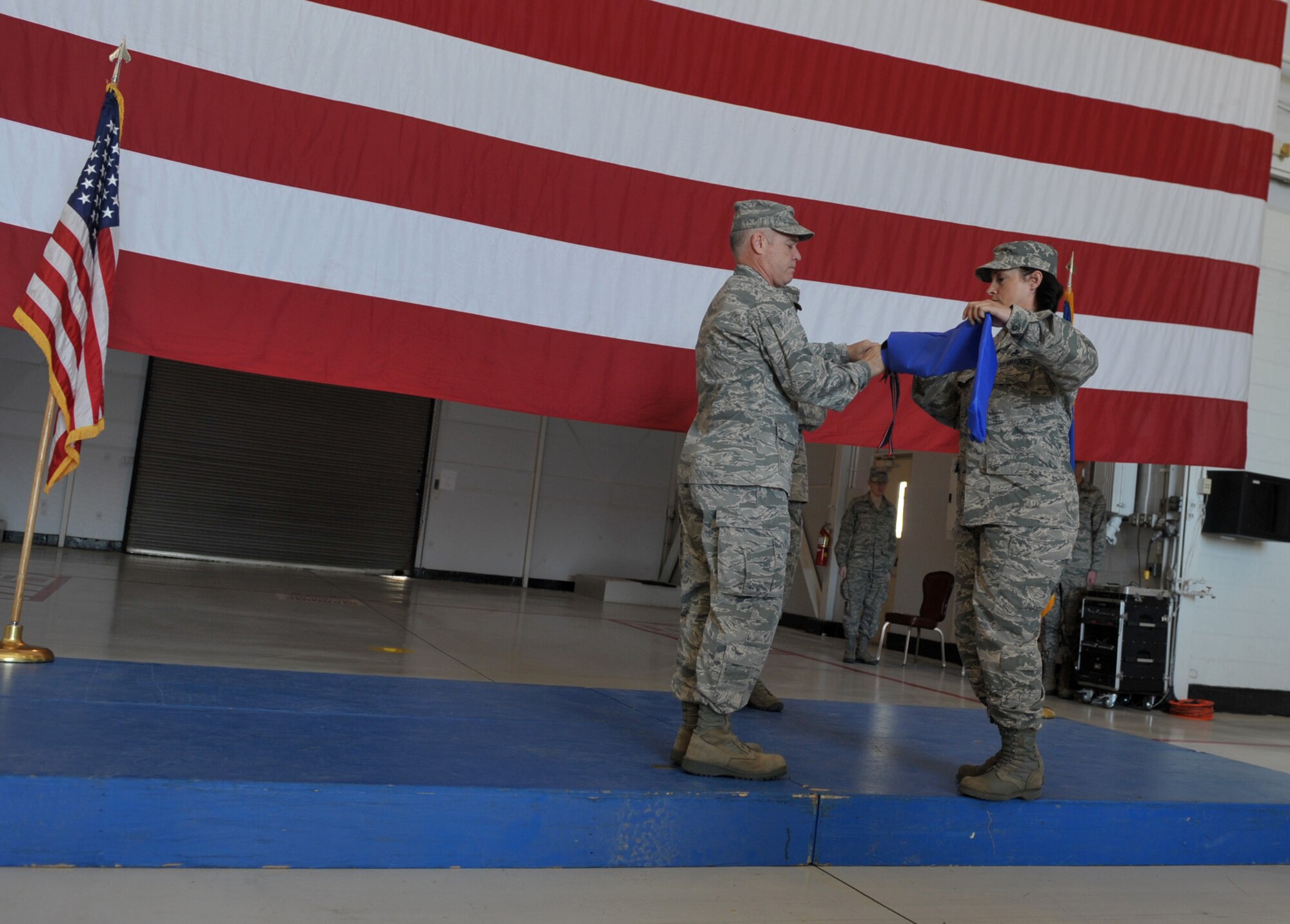U.S. Air Force Col. James McClellan, 366th Maintenance Group commander, furls the 366th Maintenance Operations Squadron guidon, May 13, 2013, at Mountain Home Air Force Base, Idaho. MOS members develop plans while implementing programs for deployments, contingencies and wartime taskings. (U.S. Air Force photo by Senior Airman Heather Hayward/Released)