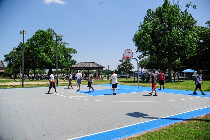Airmen prepare for a 3-on-3 basketball tournament during the Dorm Tailgate Party May 10, 2013, at Joint Base Charleston - Air Base, S.C. The Tailgate Party was designed to strengthen social ties among dorm members and enhance their esprit de corps. The party was sponsored by the Single Airman's Initiative Program and the Air Force Sergeants Association, and included a dirty truck competition, a hot dog eating contest, a basketball tournament and a live DJ. (U.S. Air Force photo/Staff Sgt. Rasheen Douglas)