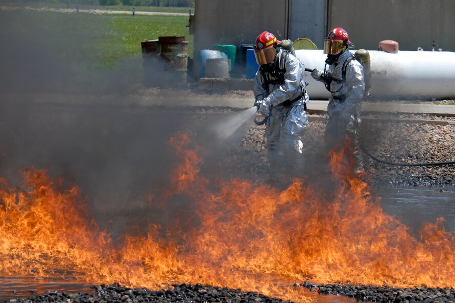 U.S. Air Force firefighters from the 182nd Civil Engineer Squadron combat a kerosene-based JP-8 jet fuel fire at the 182nd Airlift Wing in Peoria, Ill., May 13, 2013.  The firefighters tested the capabilities of their P-34 Rapid Intervention Vehicle during a controlled burn exercise using ultra-high pressure water dispersal technology.  According to the Air Force Civil Engineer Support Agency, the P-34 increases water effectiveness by up to 350 percent as compared to conventional firefighting vehicles in the Air Force’s fleet.  (U.S. Air National Guard photo by Staff Sgt. Lealan Buehrer/Released)