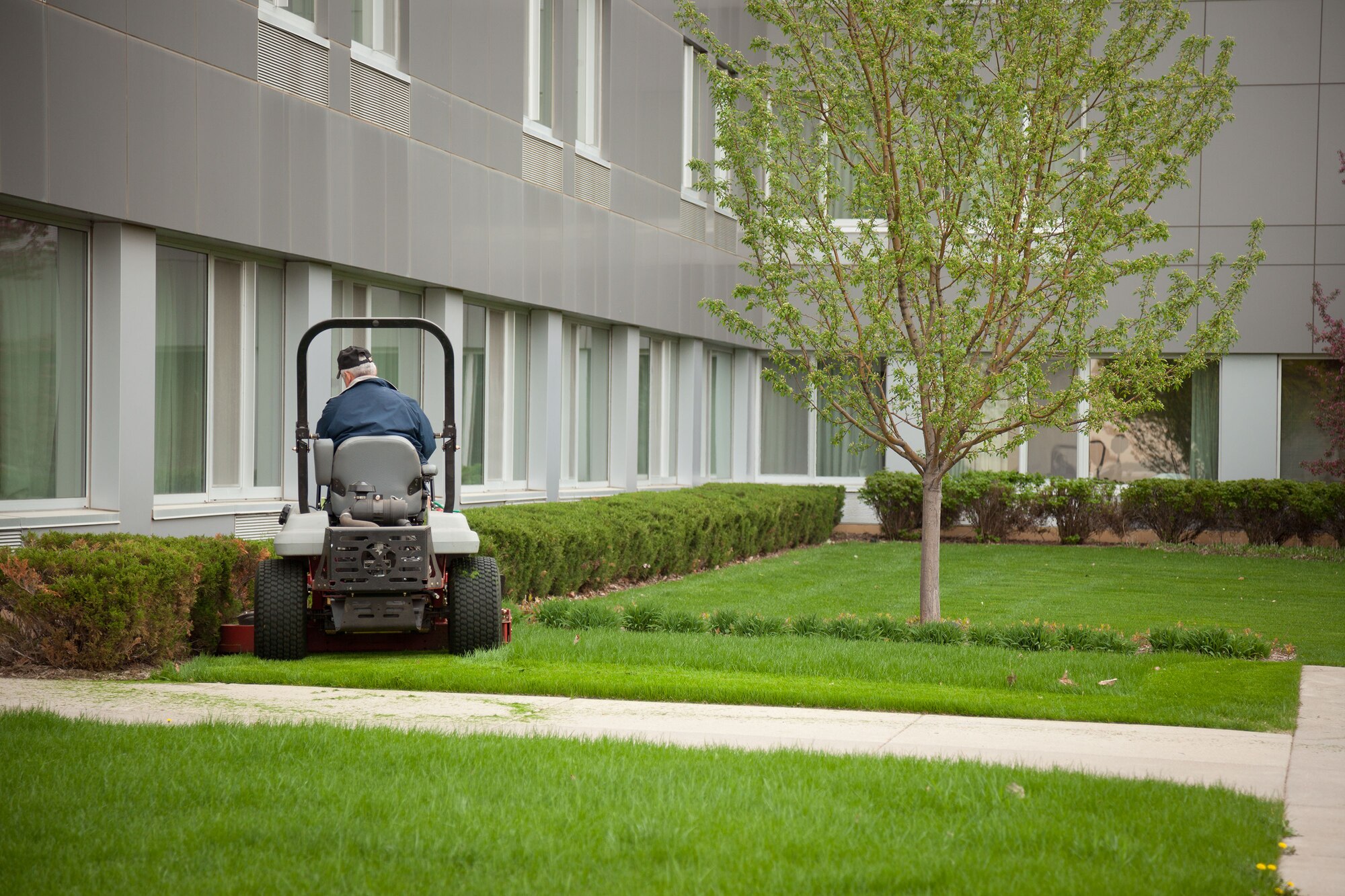 Craig Anderson, a North Country Lodge laborer, spruces up the grounds May 15.  It looks as though spring has finally come to the Minneapolis-St. Paul Air Reserve Station, Minn.  (U.S. Air Force photo/Shannon McKay)