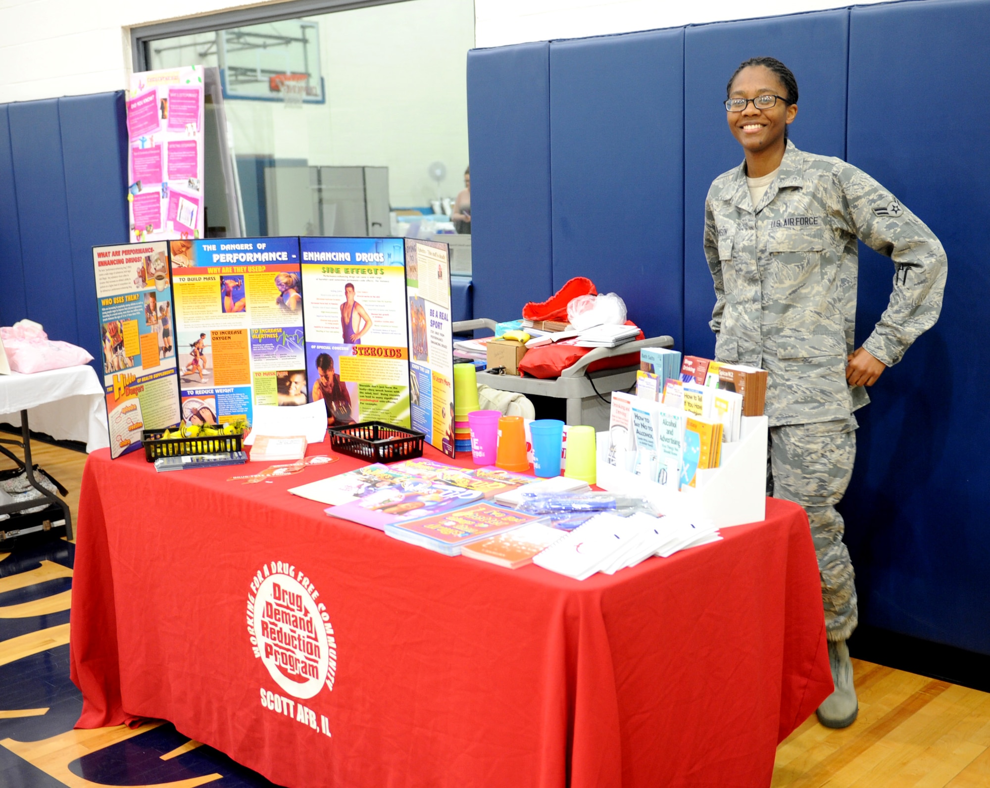 Airman First Class Briana Johnson, 375th Medical Group mental health technician, monitors the drug demand reduction program display table during the community health fair at James Gym May 10.  The health fair was part of nurses/medical technician’s week, which recognizes the work that these professionals do for the clinic patients.  (U.S. Air Force photo/Staff Sgt. Maria Bowman)