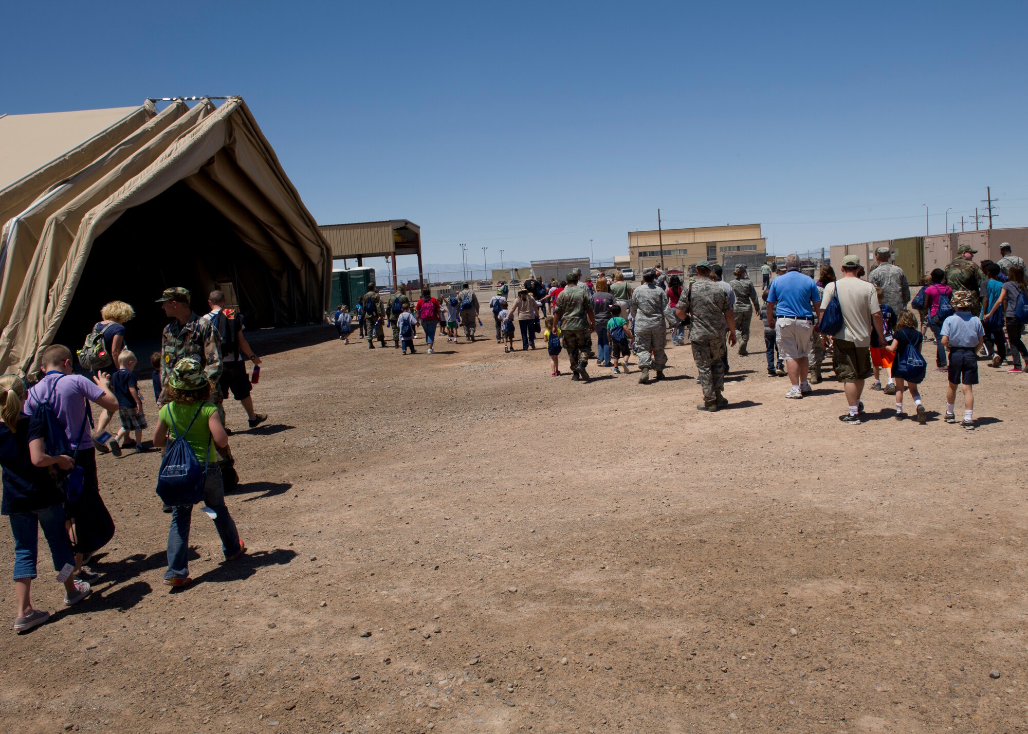 The “deployers” head home from “Bearghanistan” during Operation Kids Investigating Deployment at Holloman Air Force Base, N.M., May 13. The “deployers” experienced a recall, deployment line, deployment to “Bearghanistan,” and welcome home. (U.S. Air Force photo by Senior Airman Kasey Close/Released)