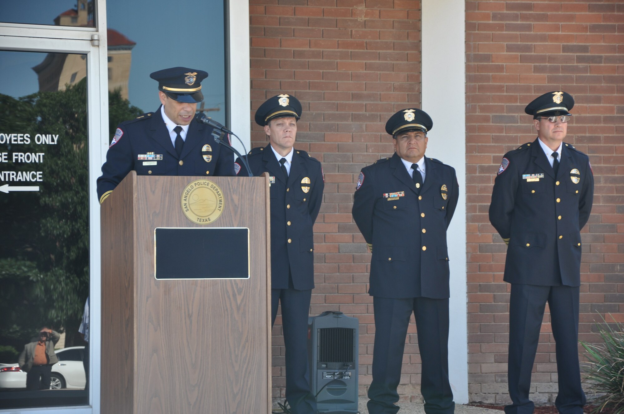 SAN ANGELO, Texas- Officer Tim Vasquez, San Angelo Police Department chief, opens the flag raising ceremony with a speech honoring fallen law enforcement officers at the SAPD, May 13. The ceremony was the first event held for National Police Week in San Angelo. (U.S. Air Force photo/ Airman 1st Class Erica Rodriguez)