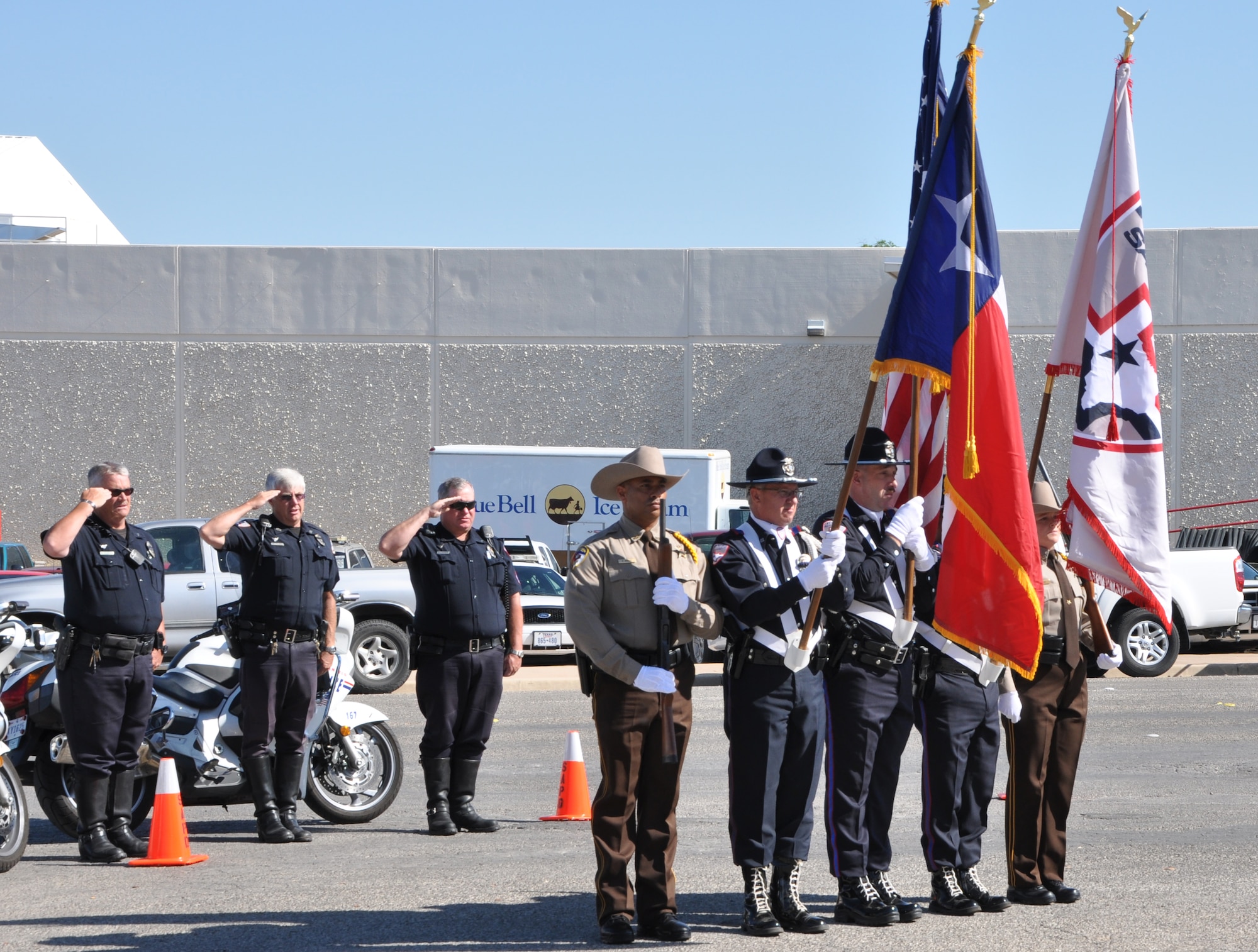 SAN ANGELO, Texas- The San Angelo Police Department Honor Guard presents the flag as the National Anthem is played during the flag raising ceremony at the SAPD, May 13. The flag raising ceremony was held on to honor fallen law enforcement officers for National Police Week. (U.S. Air Force photo/ Airman 1st Class Erica Rodriguez)
