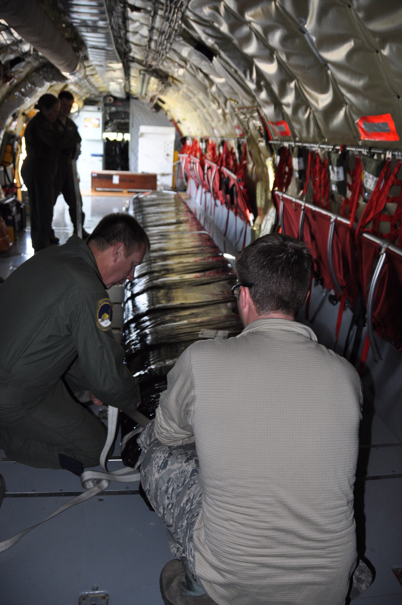 U.S. Air Force Chief Master Sgt. Frankie Rollins, 756th Air Refueling Squadron, secures two wing flaps from a B-17 Flying Fortress in a KC-135 Stratotanker from the 459th Air Refueling Wing, Joint Base Andrews, Md., May 14, 2013. The wing flaps, along with a “cherry blossom” rocket built in 1945 came from the Air and Space Museum of the Smithsonian Institution and the 459th ARW crew will transport both pieces of history to the National Museum of the United States of Air Force, Wright-Patterson Air Force Base, Ohio. (U.S. Air Force photo/Staff Sgt. Katie Spencer)