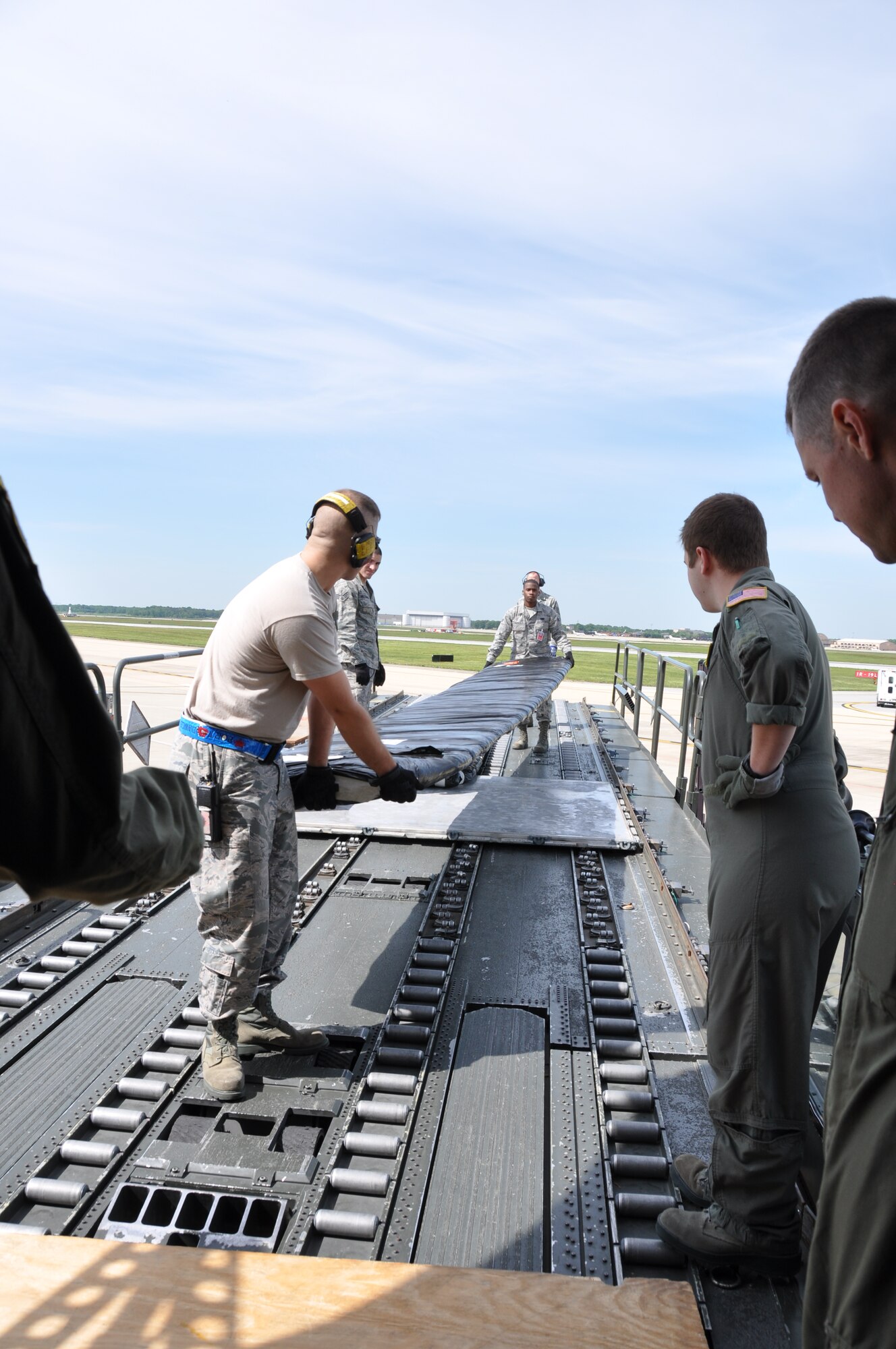 Members from the 69th Aerial Port Squadron load two wing flaps from a B-17 Flying Fortress into a KC-135 Stratotanker from the 459th Air Refueling Wing, Joint Base Andrews, Md., May 14, 2013. The wing flaps, along with a “cherry blossom” rocket built in 1945 came from the Air and Space Museum of the Smithsonian Institution and the 459th ARW crew will transport both pieces of history to the National Museum of the United States of Air Force, Wright-Patterson Air Force Base, Ohio. (U.S. Air Force photo/Staff Sgt. Katie Spencer)