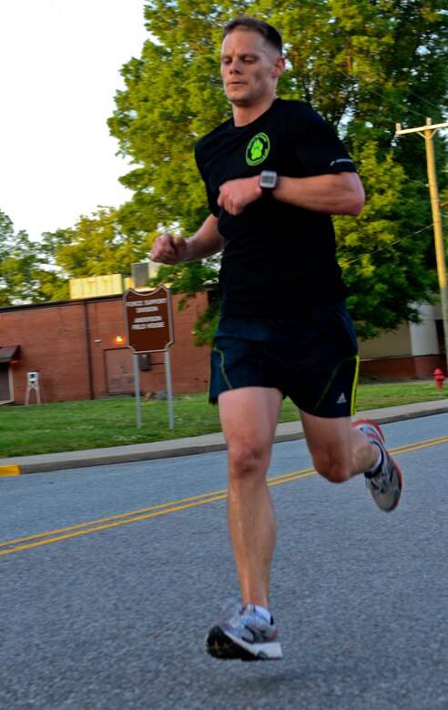 U.S. Army Capt. Zach Valentine, 1st Battalion, 210th Aviation Regiment B company commander, sprints toward the finish line during the Fort Eustis Running Club’s Army Ten-Miler team tryouts at Fort Eustis, Va., May 15, 2013. The club will host a second tryout this summer to finalize its team for the annual 10-mile race, held each October in Washington, D.C. (U.S. Air Force photo by Airman 1st Class R. Alex Durbin/Released)