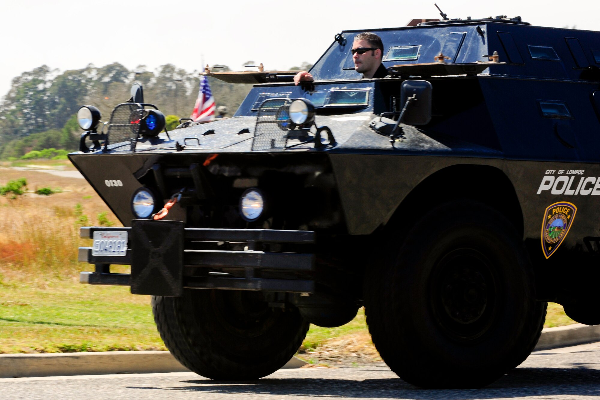 VANDENBERG AIR FORCE BASE, Calif. – Members of the Lompoc Police Department participate in Team V’s National Police Week parade here Monday, May 13, 2013. The 30th Security Forces Squadron hosted a parade on base for all military, civilians and their families as part of their National Police Week celebration. The event, which included Team V defenders and local law enforcement agencies, showcased many different types of vehicles and animals law enforcement agencies use. (U.S. Air Force photo/Airman Yvonne Morales) 