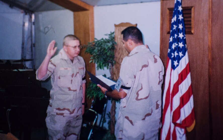 U.S. Air Force Chaplain (Capt.) Bill O’Sullivan, then a captain, administers the Oath of Enlistment to Senior Airman Erik Harp, at Price Sultan Air Base, Saudi Arabia, in July 1997. Harp, now a chaplain himself, was promoted to major April 30, and O’Sullivan, now a lieutenant colonel, administered the Oath of Enlistment when the two reunited after more than 15 years. (Courtesy photo)
