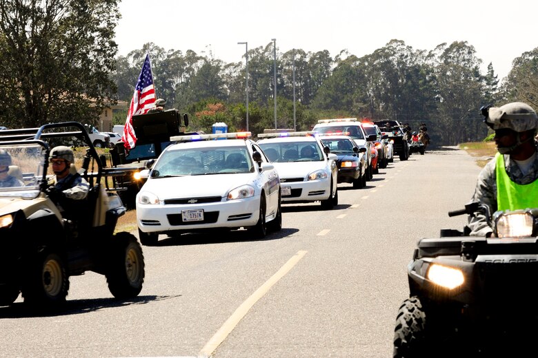 VANDENBERG AIR FORCE BASE, Calif. – Military police vehicles are staged on the side of the road before the start of Team V’s National Police Week parade here Monday, May 13, 2013. The 30th Security Forces Squadron hosted a parade on base for all military, civilians and their families as part of their National Police Week celebration. The event, which included Team V defenders and local law enforcement agencies, showcased many different types of vehicles and animals law enforcement agencies use. (U.S. Air Force photo/Airman Yvonne Morales) 