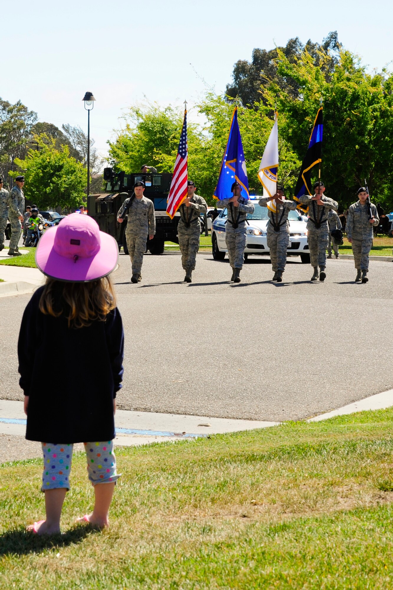 VANDENBERG AIR FORCE BASE, Calif. – Members of the 30th Security Forces Squadron march in formation during Team V’s National Police Week parade here Monday, May 13, 2013. The 30th Security Forces Squadron hosted a parade on base for all military, civilians and their families as part of their National Police Week celebration. The event, which included Team V defenders and local law enforcement agencies, showcased many different types of vehicles and animals law enforcement agencies use. (U.S. Air Force photo/Airman Yvonne Morales)