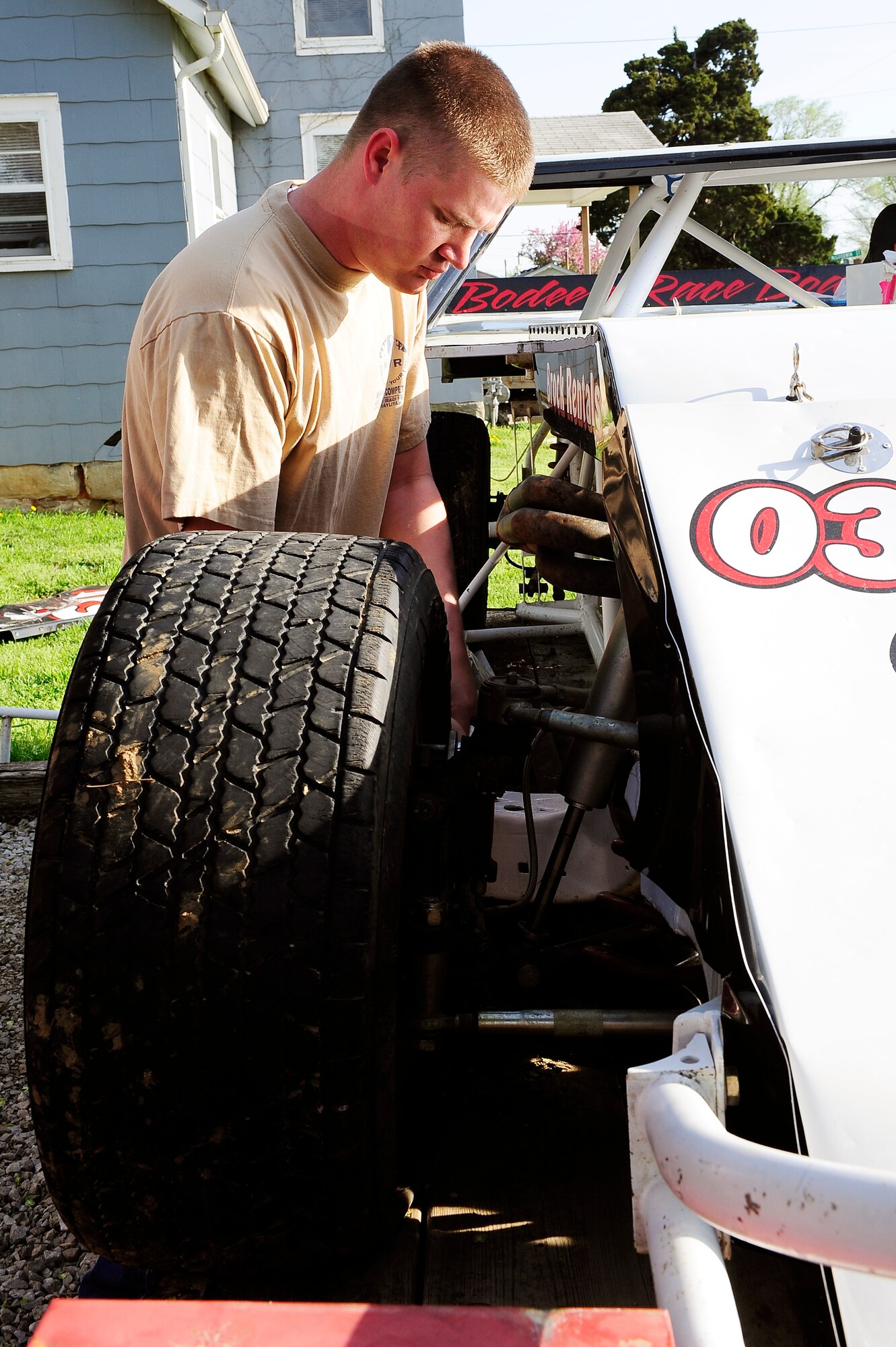 Staff Sgt. Chris Brockway, 442nd Logistics Readiness Squadron traffic management office apprentice, prepares to unload his B-Modified racecar from its trailer in Warrensburg, Mo., April 29, 2013. Brockway works on the car by himself with the help of only one crew member. (U.S. Air Force photo by Airman 1st Class Shelby R. Orozco/Released)