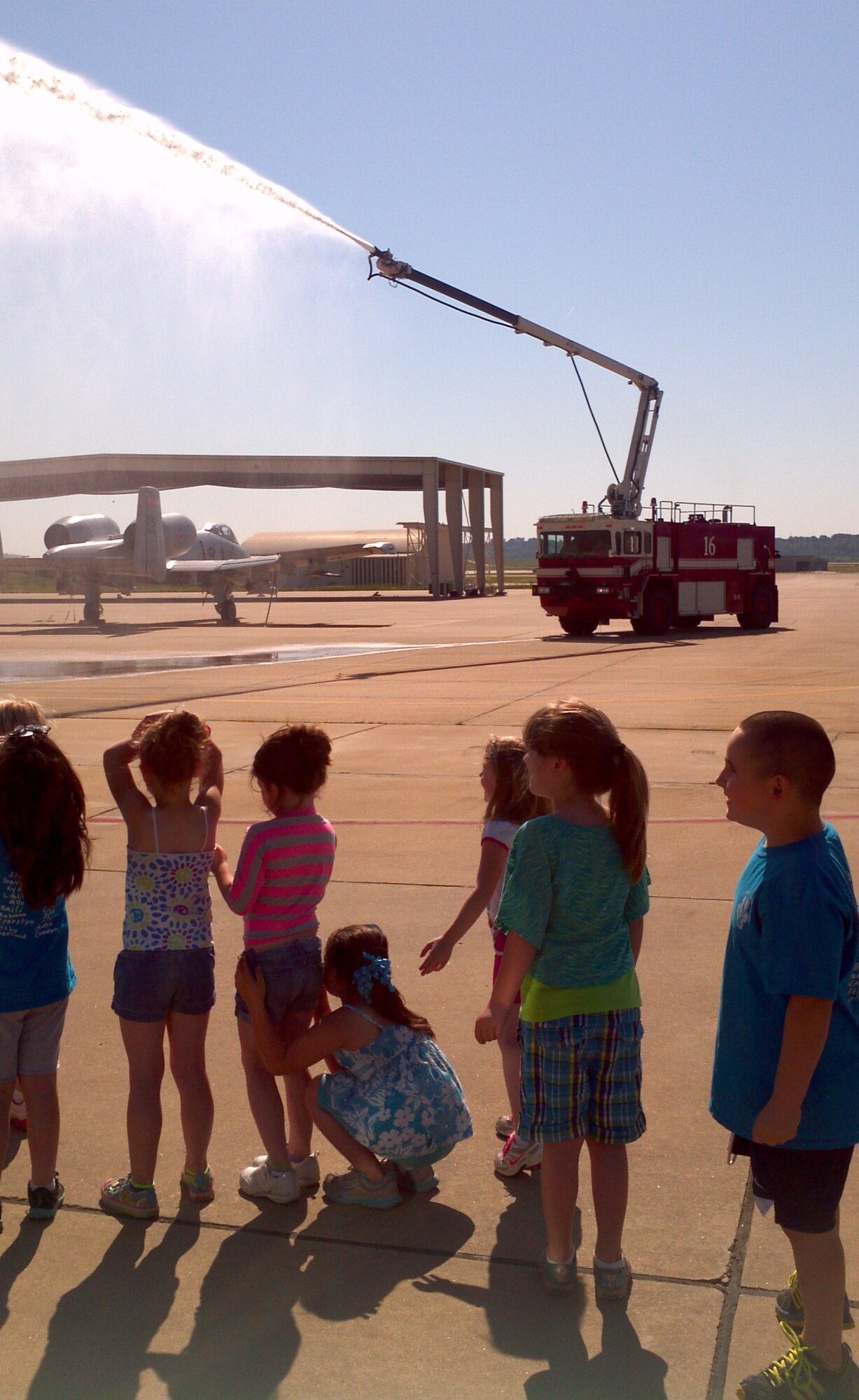 Firefighters with the 188th Fire Emergency Services Flight provide a fire truck exhibition for a group of kindergarteners from Alma Primary School during a tour of the 188th Fighter Wing May 14, 2013. (U.S. Air National Guard photo by Maj. Heath Allen/188th Fighter Wing)
