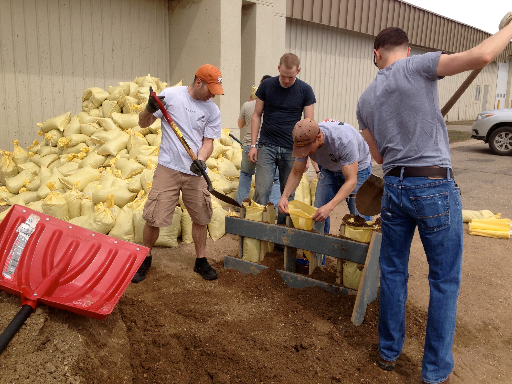 MINOT, N.D. -- Volunteers from Minot AFB and the surrounding community converted a few piles of sand and dirt into more than 1,000 sandbags as part of the recent flood preparations. The volunteers were also crucial in making approximately 3,000 sandbags in Burlington. (Courtesy photo)