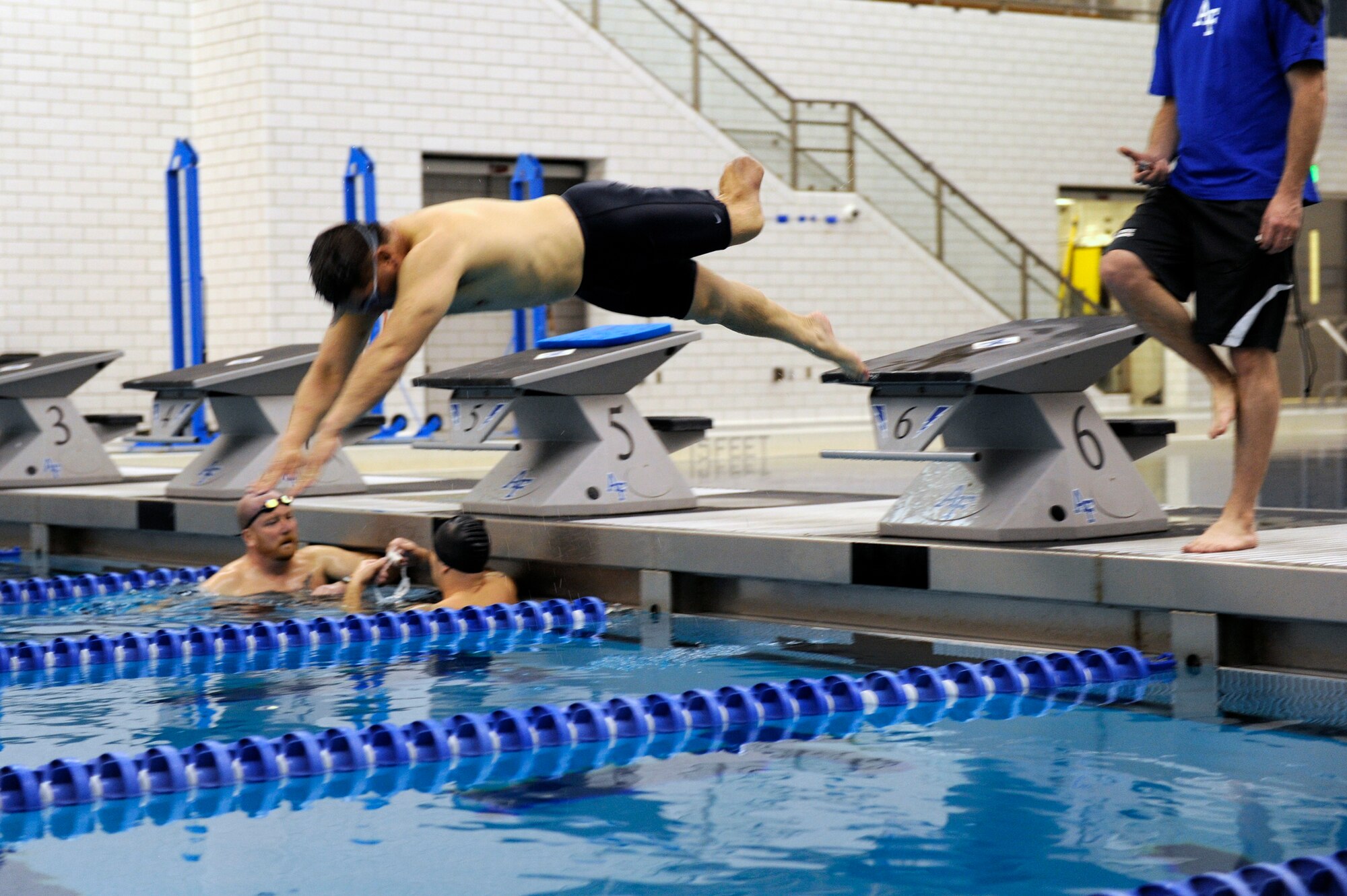 Senior Master Sgt. Martin Smith jumps into the Academy indoor pool prior to the start of the 2013 Warrior Games in Colorado Springs, Colo. More than 200 athletes from all services are competing from May 11 through May 16, 2013. (U.S. Air Force photo/Desiree N. Palacios) 

 