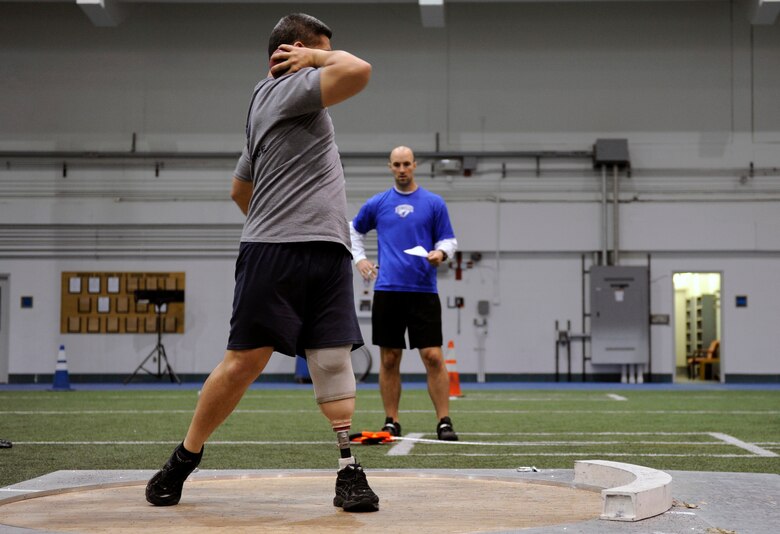 Senior Master Sgt. Martin Smith twists his body as he practices shot put prior to the start of the 2013 Warrior Games in Colorado Springs, Colo. More than 200 athletes from all services are competing from May 11 through May 16, 2013. (U.S. Air Force photo/Desiree N. Palacios)
 

 
