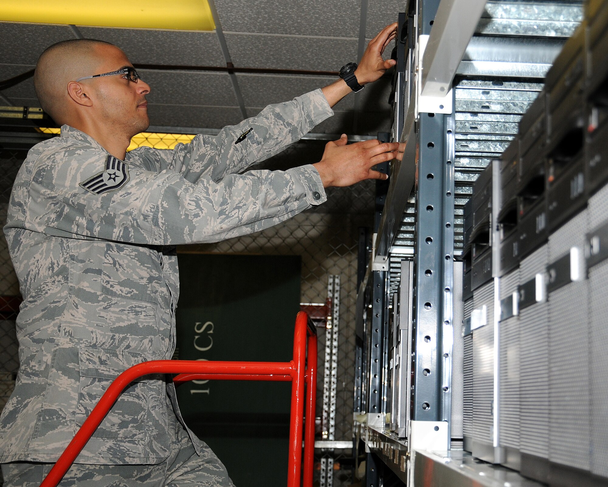 Staff Sgt. Juan Vasquez Perez, 100th Communication Squadron NCO in charge of requirements and architecture from Santo Domingo, Dominican Republic, inventories equipment for the land mobile radio system upgrade project May 7, 2013, at RAF Mildenhall, England.  Project material is received and stored in a secure area awaiting the project implementation phase. (U.S. Air Force photo by Gina Randall/Released)