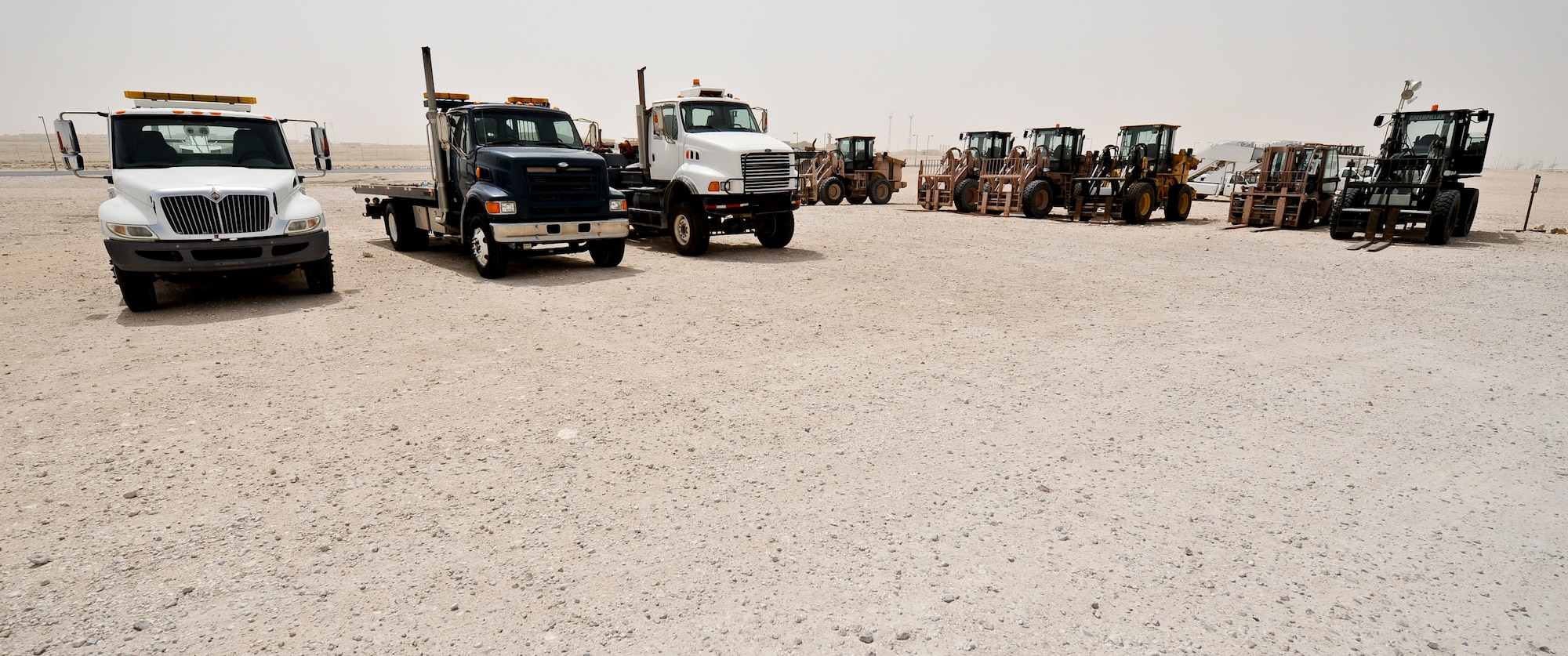 Vehicles assigned to the 379th Expeditionary Logistics Readiness Squadron sit at the ready to support whatever the mission calls for in Southwest Asia, May 14, 2013. (U.S. Air Force photo/Senior Airman Benjamin Stratton)