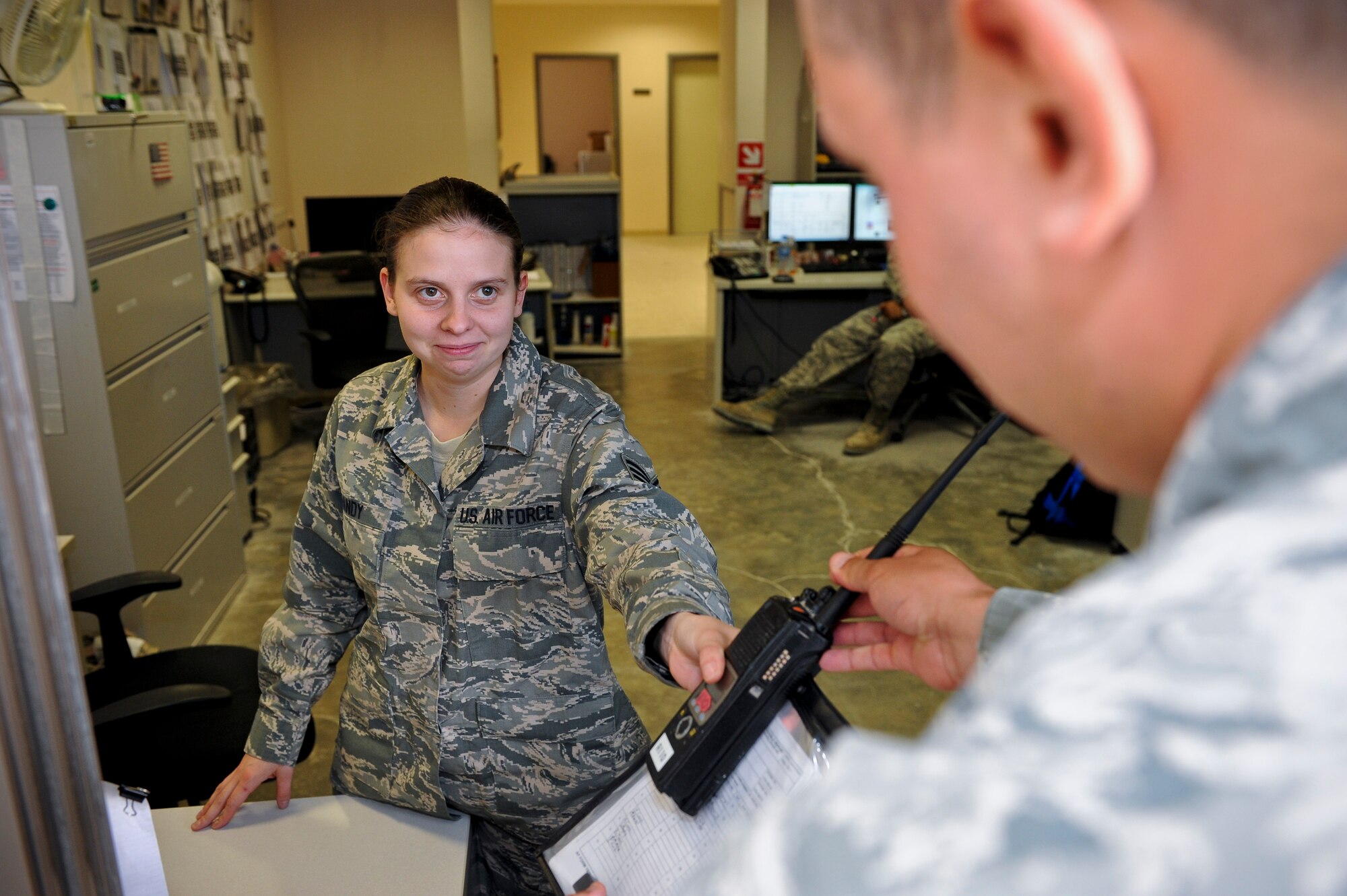 Staff Sgt. Stephanie Bandy assists a customer as part of her duties with the 379th Expeditionary Logistics Readiness Squadron vehicle operations in Southwest Asia, May 14, 2013. Bandy is a 379th ELRS vehicle dispatcher deployed from Joint Base Charleston - Air Base, S.C. (U.S. Air Force photo/Senior Airman Benjamin Stratton)