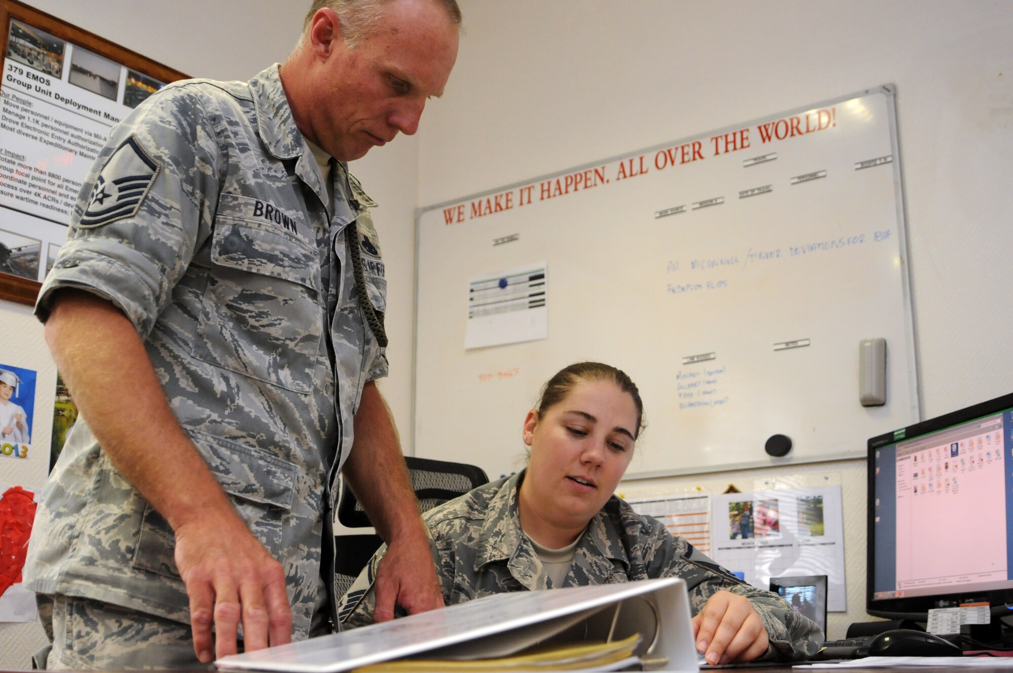 Master Sgts. Martin Brown and Renee Hess are unit deployment managers for the 379th Expeditionary Maintenance Group, helping to move maintenance specialists into and out of the U.S. Central Command theater of operations. Hess, from Shaw Air Force Base, S.C., and Brown, from Davis-Monthan AFB, Ariz., have helped deploy into and out of theater hundreds of maintenance troops. (U.S. Air Force photo/Master Sgt. Christian Michael)
