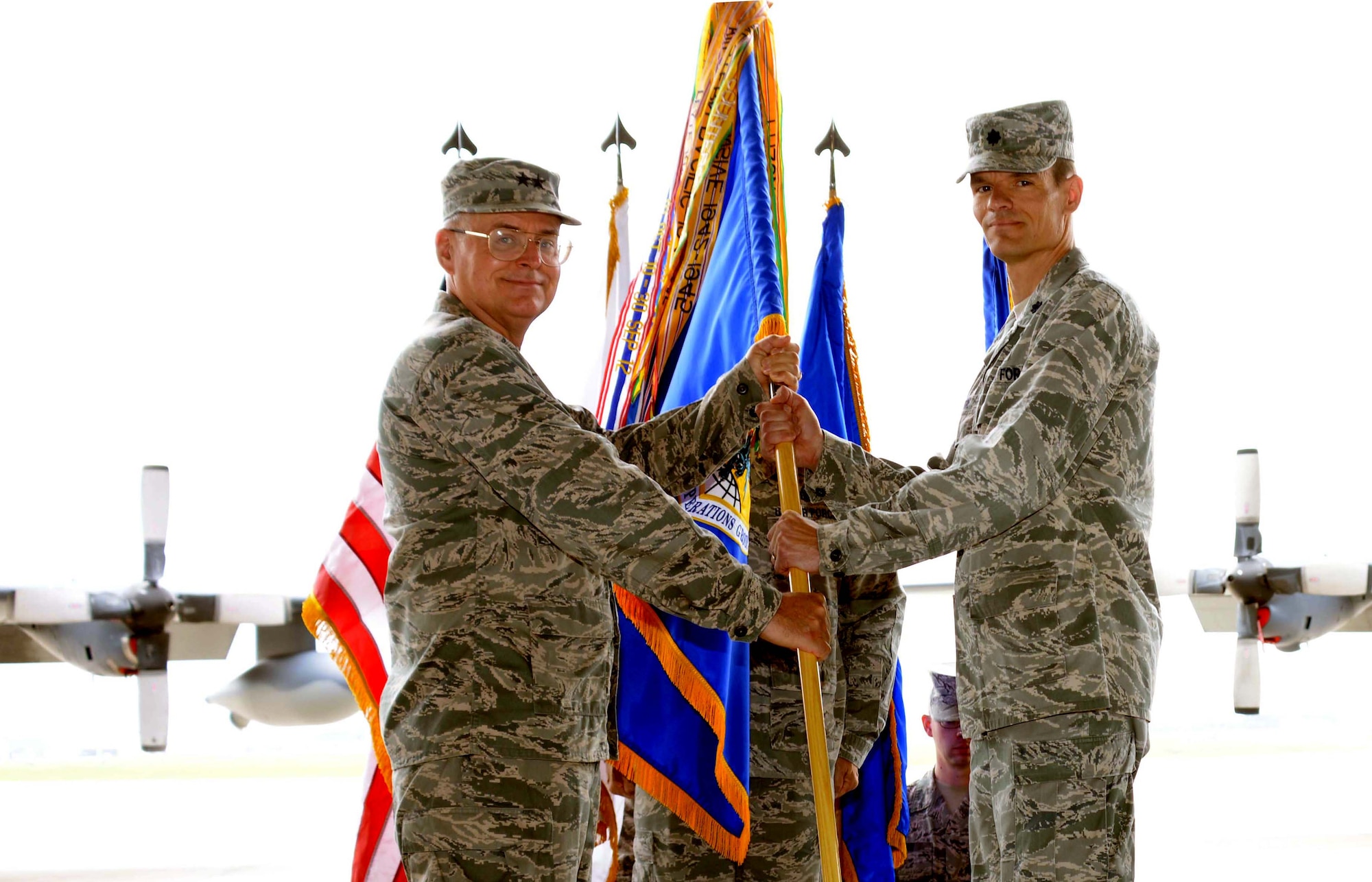 U.S. Air Force Lt. Col. Ben Maitre, 353rd Special Operations Group
commander, receives the guidon from Maj. Gen. George Williams, Air Force
Special Operations Command, vice commander during the 353rd SOG assumption
of command on Kadena Air Base, Japan, May 10, 2013.  Maitre most recently
served as a National Defense Fellow at the U.S. Department of State in
Washington, D.C. (U.S. Air Force photos by Tech. Sgt. Kristine
Dreyer/Released)
