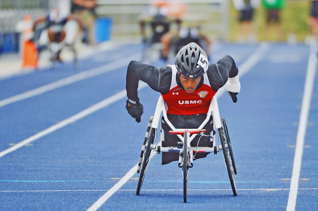 Marine Corps Cpl. Anthony McDaniel wins the men's 200-meter wheelchair race during the 2013 Warrior Games in Colorado Springs, Colo., May 14, 2013. 