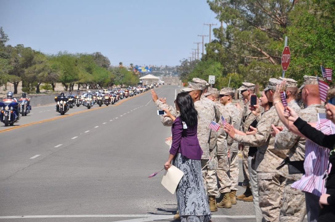 Marines from the headquarters building greet and cheer on riders participating in the annual Run for the Wall.