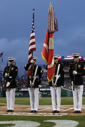 The Marine Corps Color Guard presented and posted the colors during the U.S. Marine Day at Nationals Park in Washington May 8. The four Marine Corps infantrymen travel around the nation bearing the official battle colors of the Marines Corps. 