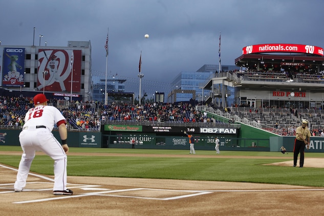 Lt. Gen. Willie Williams, director of Marine Corps staff at Headquarters Marine Corps, throws the ceremonial first pitch during the U.S. Marine Day at Nationals Park in Washington May 8. Williams threw a high arching pitch to Chad Tracy, the Washington Nationals third baseman. Williams will retire this summer after 40 years of service.
