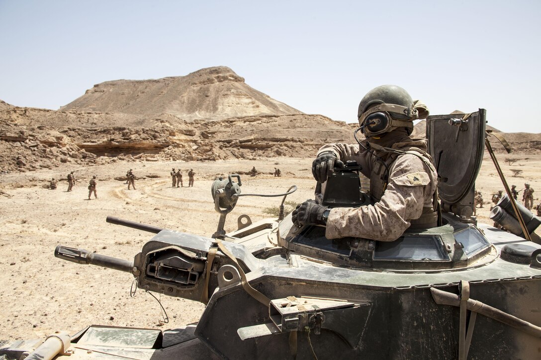 Cpl. Logan Grguric, crew chief, Amphibious Assault Vehicle Platoon, Battalion Landing Team 3/2, 26th Marine Expeditionary Unit (MEU), provides security and transportation to the mechanized company rehearsing a tactical recovery of aircraft and personnel during an exercise in the 5th Fleet area of responsibility April 23, 2013. The 26th Marine Expeditionary Unit is currently deployed as part of the Kearsarge Amphibious Ready Group to the 5th Fleet area of responsibility. The 26th MEU operates continuously across the globe, providing the president and unified combatant commanders with a forward-deployed, sea-based quick reaction force. The MEU is a Marine Air-Ground Task Force capable of conducting amphibious operations, crisis response, and limited contingency operations.
(U.S. Marine Corps photo by Staff Sgt. Edward Guevara/Released)