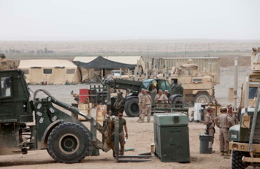 Marines with 2nd Battalion, 8th Marine Regiment, retrograde gear and equipment as part of the demilitarization process here, May 11. "America's Battalion" completes combat logistics convoys that aid in the demilitarization and closing of FOBs within their area of operation.  (U.S. Marine Corps photo taken by Lance Cpl. Mel Johnson)