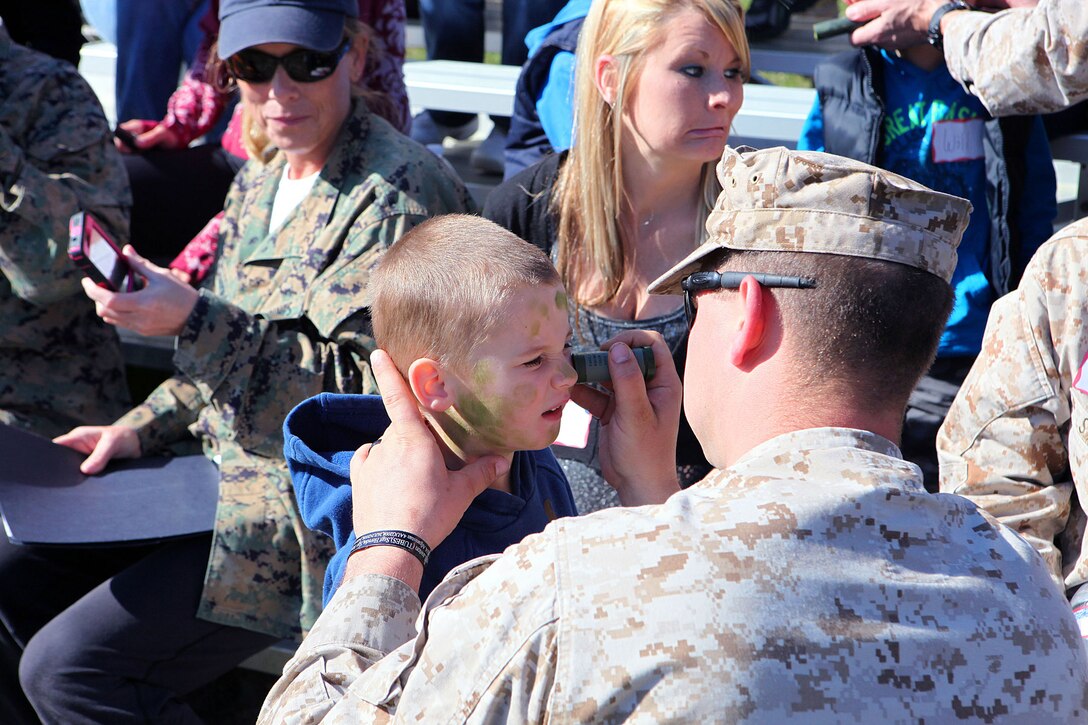 Marine spouses and children participate in a family day sponsored by U.S. Marine Corps Forces, Special Operations Command, April 26, 2013. The spouses shot live weapons, rappelled and were taught martial arts by Marine instructors. Children played games and did modified exercises during the event. Static displays showed MARSOC weapons and gear. After all the events the Marines and families had a barbecue.   