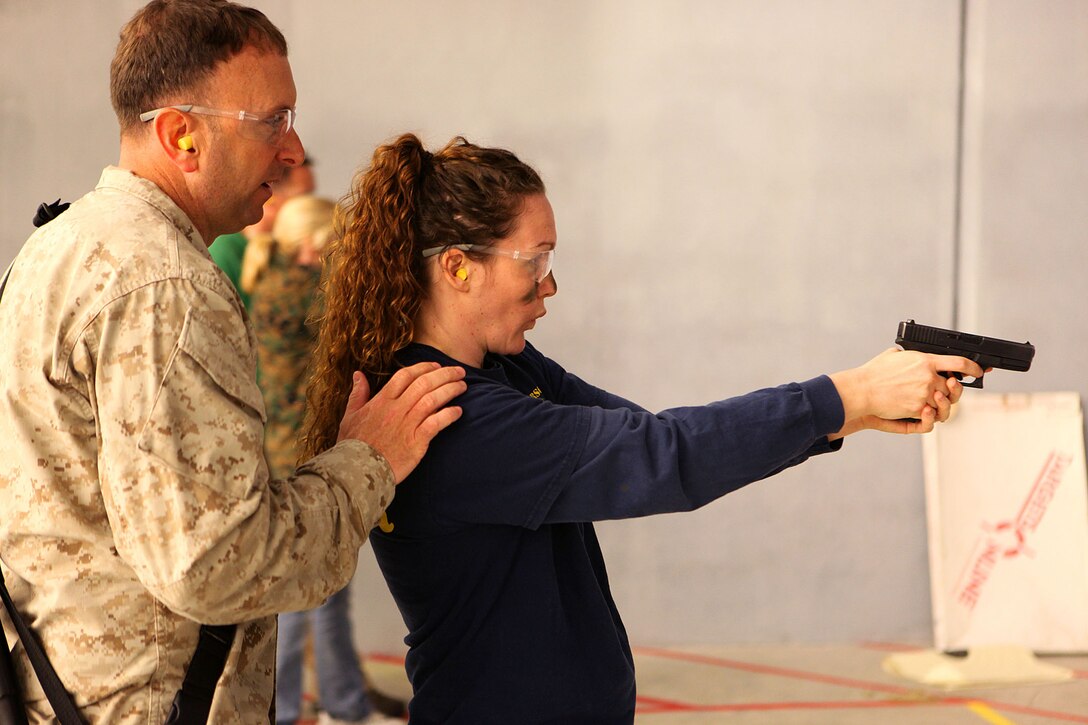Marine spouses and children participate in a family day sponsored by U.S. Marine Corps Forces, Special Operations Command, April 26, 2013. The spouses shot live weapons, rappelled and were taught martial arts by Marine instructors. Children played games and did modified exercises during the event. Static displays showed MARSOC weapons and gear. After all the events the Marines and families had a barbecue.   