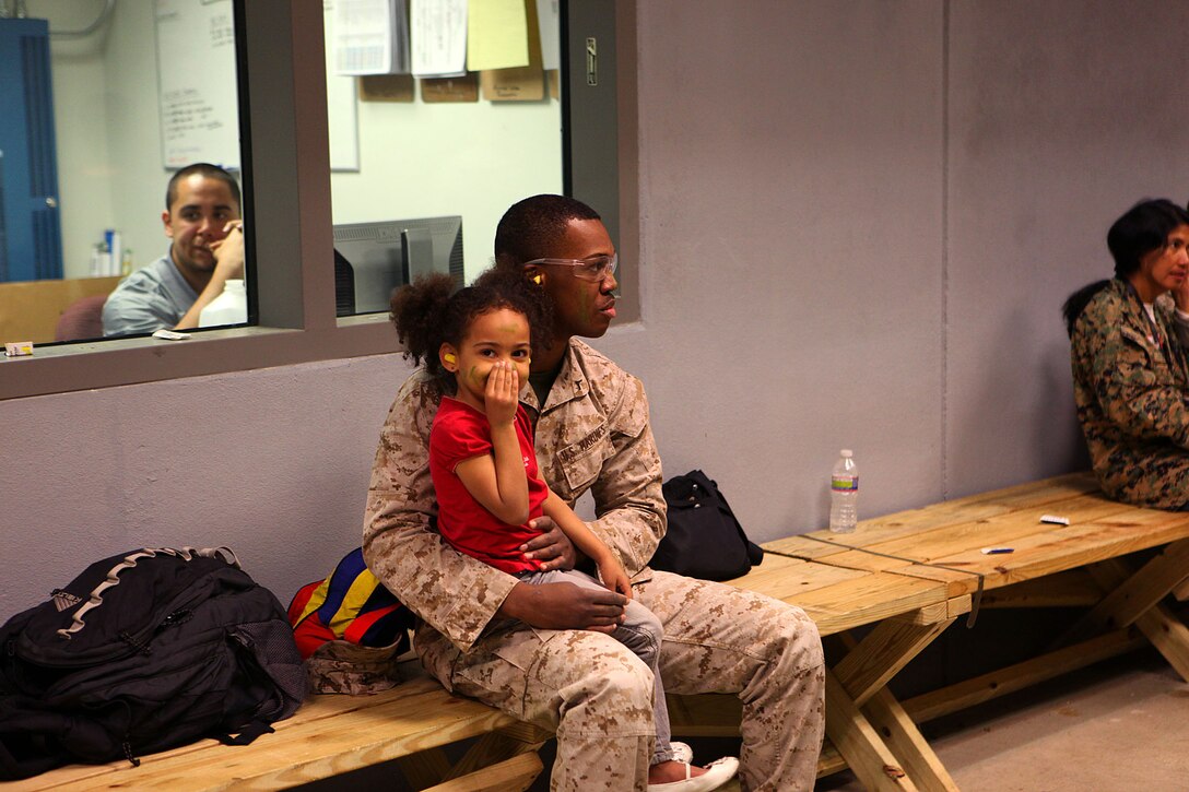 Marine spouses and children participate in a family day sponsored by U.S. Marine Corps Forces, Special Operations Command, April 26, 2013. The spouses shot live weapons, rappelled and were taught martial arts by Marine instructors. Children played games and did modified exercises during the event. Static displays showed MARSOC weapons and gear. After all the events the Marines and families had a barbecue.   