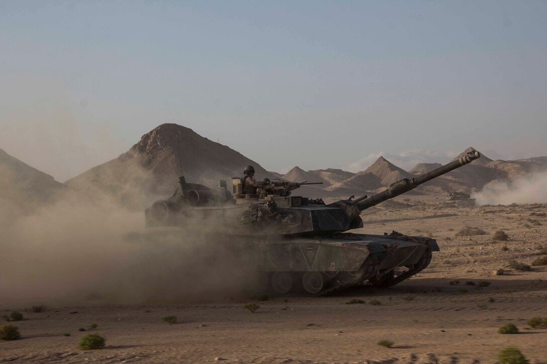U.S. Marines assigned to Tank Platoon, Battalion Landing Team 3/2, 26th Marine Expeditionary Unit (MEU) conduct a live-fire range in their M1A1 Abrams main battle tanks during an exercise in the 5th Fleet area of responsibility, April 24, 2013. The 26th MEU is currently deployed as part of the Kearsarge Amphibious Ready Group to the 5th Fleet area of responsibility. The 26th MEU operates continuously across the globe, providing the president and unified combatant commanders with a forward-deployed, sea-based quick reaction force. The MEU is a Marine Air-Ground Task Force capable of conducting amphibious operations, crisis response, and limited contingency operations.
(U.S. Marine Corps photo by Cpl. Michael S. Lockett/Released)
