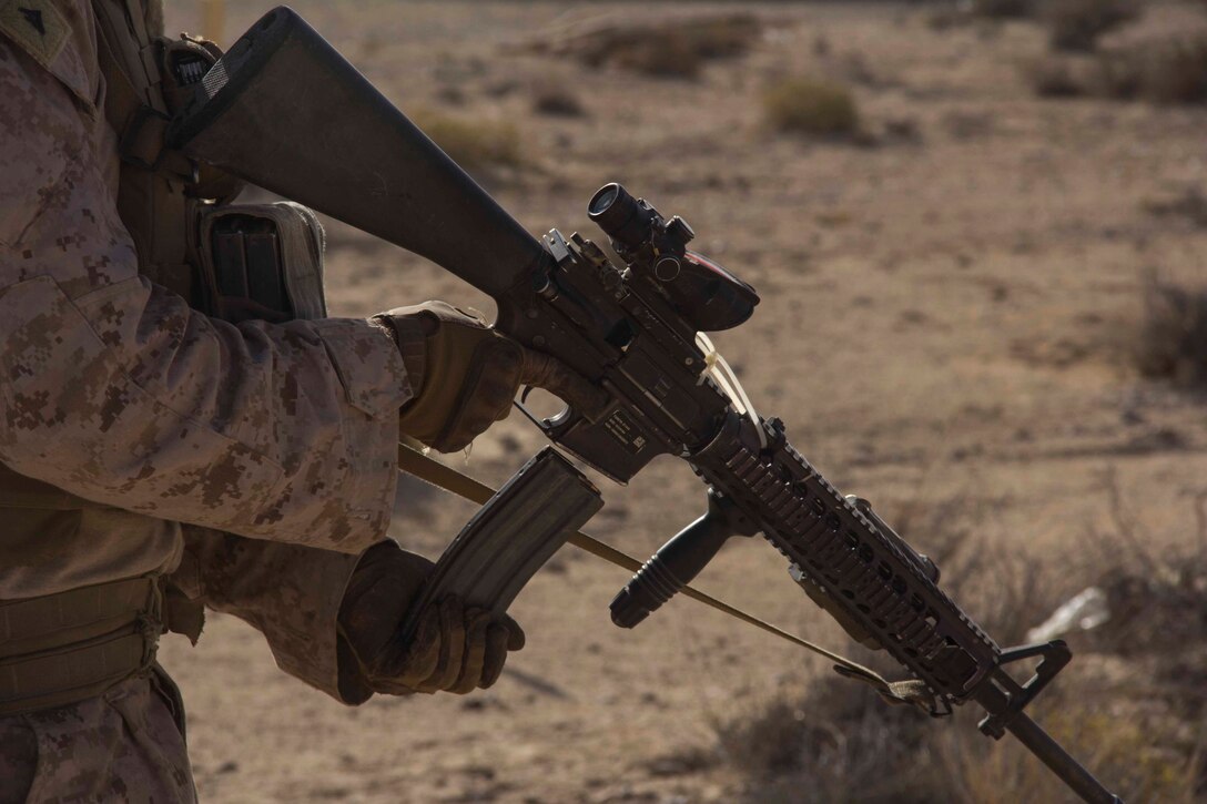 Lance Cpl. Jonathan Callis, point man from Henry County, Ky., assigned to India Company, Battalion Landing Team 3/2, 26th Marine Expeditionary Unit (MEU) loads a magazine during a fire team range as part of an exercise in the 5th Fleet area of responsibility, April 24, 2013. The 26th MEU is currently deployed as part of the Kearsarge Amphibious Ready Group to the 5th Fleet area of responsibility. The 26th MEU operates continuously across the globe, providing the president and unified combatant commanders with a forward-deployed, sea-based quick reaction force. The MEU is a Marine Air-Ground Task Force capable of conducting amphibious operations, crisis response, and limited contingency operations.
(U.S. Marine Corps photo by Cpl. Michael S. Lockett/Released)
