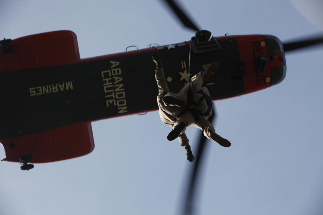 Marines and Sailors with Marine Transport Squadron 1 conduct repelling and live hoisting for rescue swimmer under instruction training May 10.  