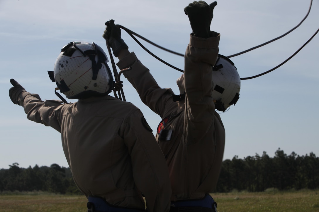 Marines and Sailors with Marine Transport Squadron 1 conduct repelling and live hoisting for rescue swimmer under instruction training May 10.  