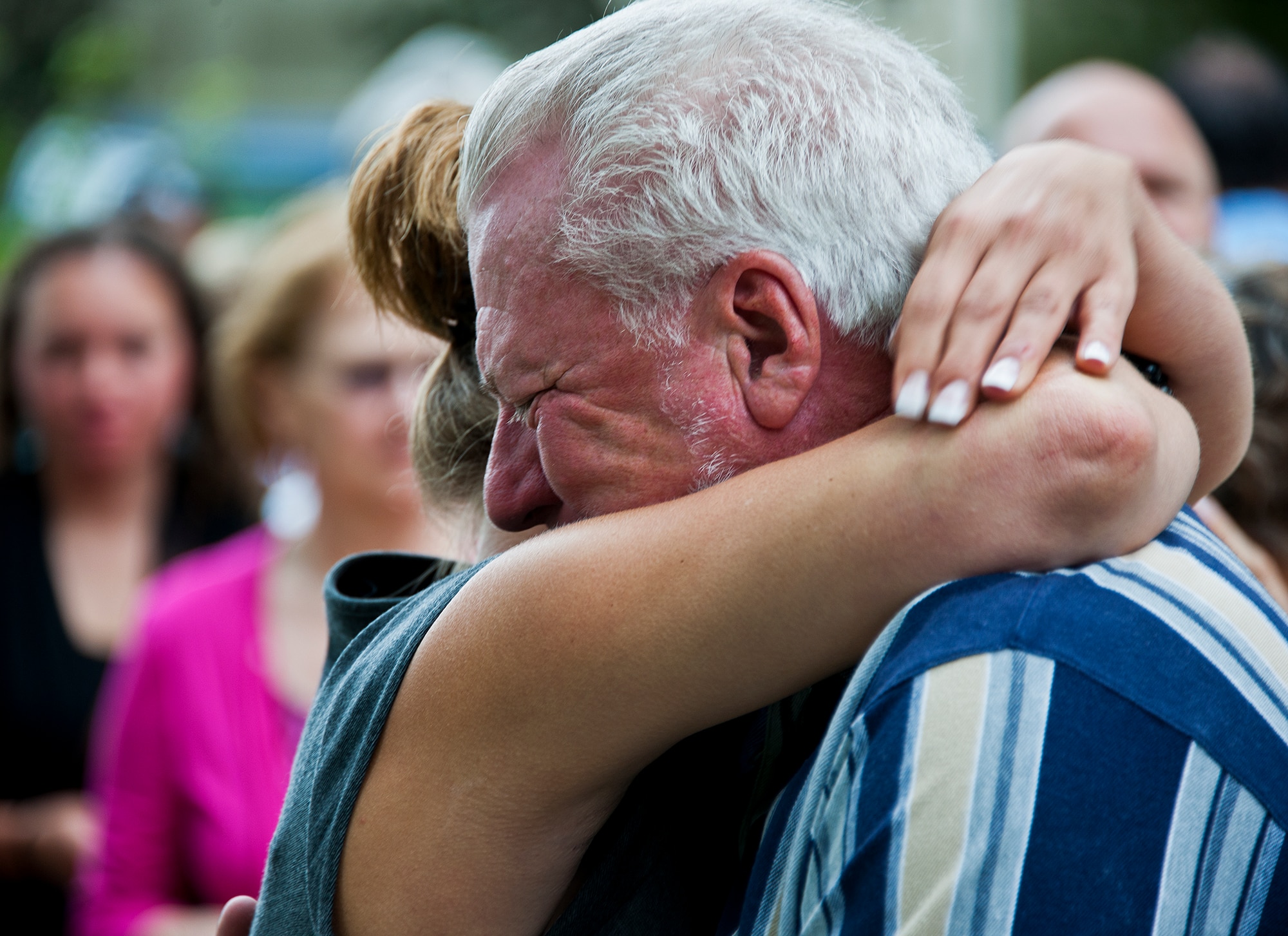 Patrick Griffin Sr., and Michelle Griffin, the father and widow of Staff Sgt. Patrick Griffin, share an emotional moment at the end of the Griffin Memorial Rededication Ceremony May 16 at Eglin Air Force Base, Fla.  Griffin, a member of the 728th Air Control Squadron, was the only Eglin casualty of Operation Iraqi Freedom when he was killed by a roadside bomb May 13, 2003.  His memorial was moved from the 728th ACS building, which will be deactivated May 17, to its new location close to the 33rd Fighter Wing’s Khobar Towers Memorial.  (U.S. Air Force photo/Samuel King Jr.)