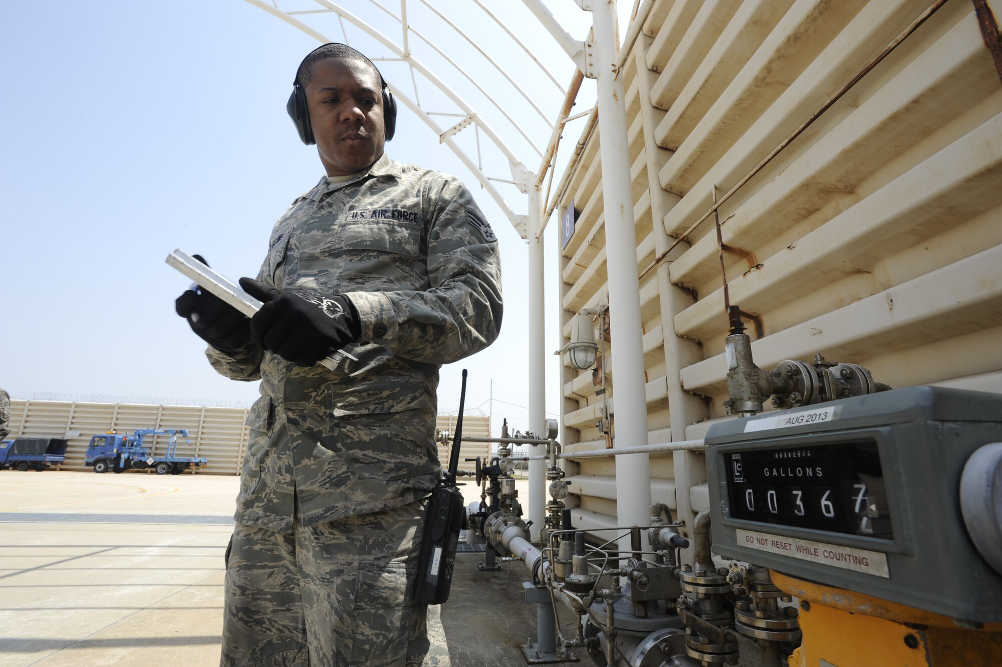 KUNSAN AIR BASE, Republic of Korea – Senior Airman Jamar Huggins, 8th Logistics Readiness Squadron petroleum, oil and lubricants technician tracks the amount of JP-8 being pumped, during a hot pit refueling operation with Republic of Korea air force at Kunsan Air Base, Republic of Korea May 6, 2013. The average jet requires 1,200 to 1,400 gallons of fuel to fill up. (U.S. Air Force photo by Staff Sgt. Tong Duong/ Released)