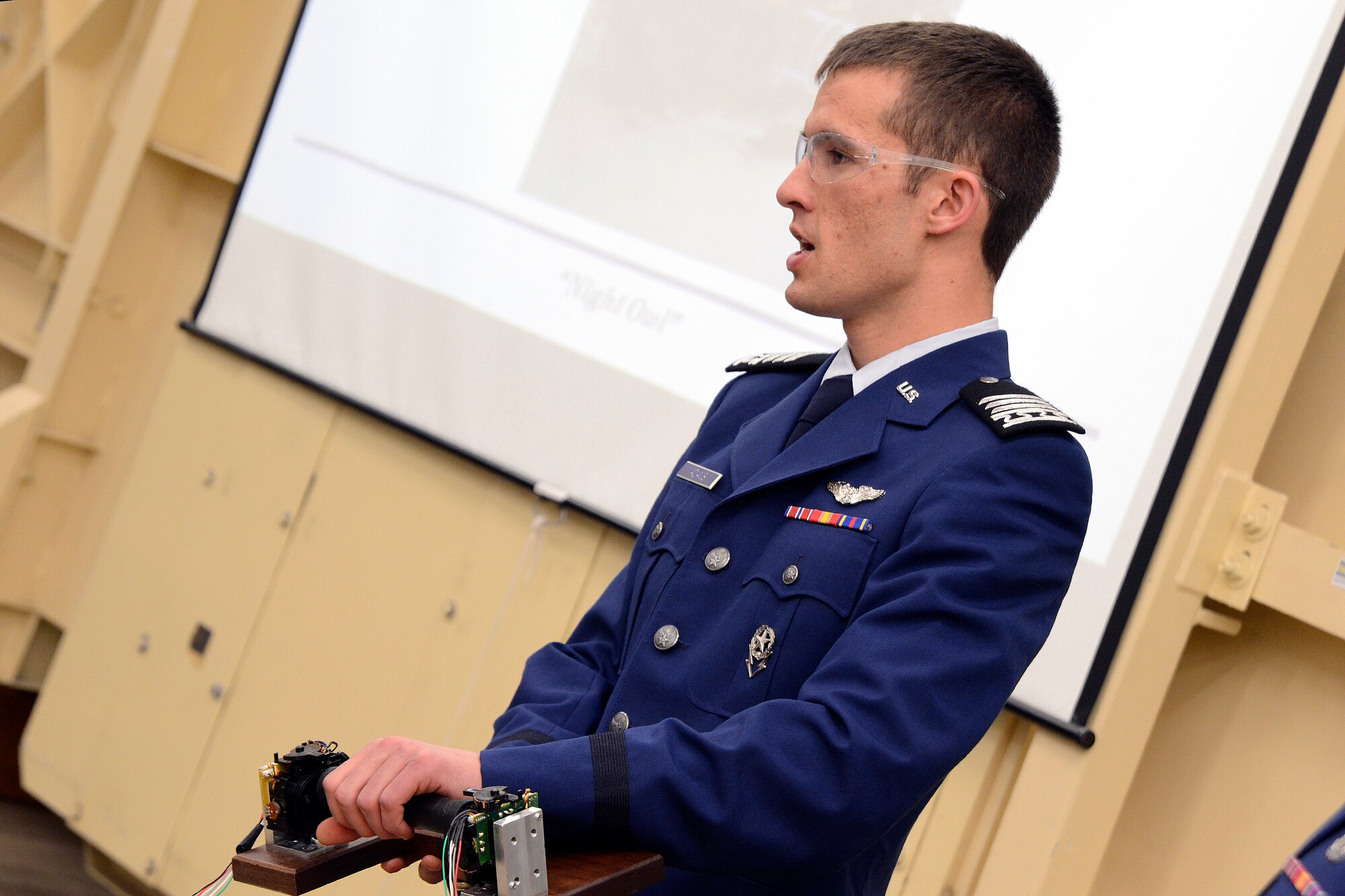 Cadet 1st Class Zachary Adams controls the "Night Owl," a cyclogyro capable of omnidirectional thrust, during a demonstration to Air Force Academy senior leaders and Boeing representatives May 13, 2013. Adams was the chief engineer for the project, which included eight other cadets. (U.S. Air Force photo/Mike Kaplan)