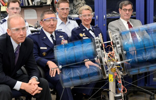 Dennis Muilenburg, Air Force Academy Superintendent Lt. Gen. Mike Gould, Dean of the Faculty Brig. Gen. Dana Born and others watch a demonstration of a cadet aeronautical engineering project called the "Night Owl" in the Aeronautics Laboratory May 13, 2013. A team of nine cadets designed the cyclogyro, which is designed to direct thrust in any direction. Muilenburg is the president and CEO of Boeing Defense, Space and Security. (U.S. Air Force photo/Mike Kaplan)