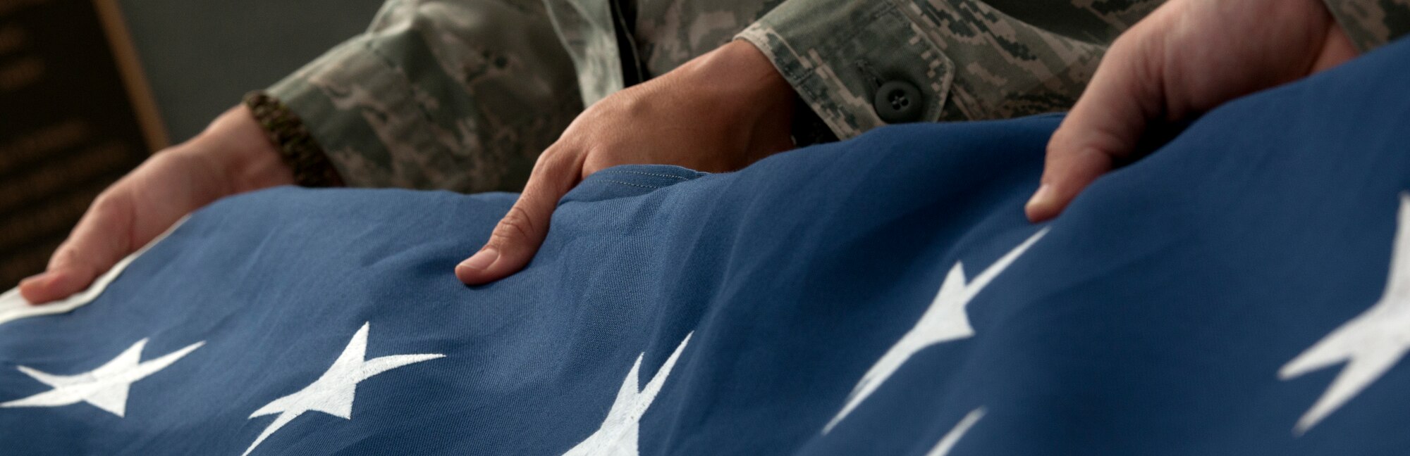 ALTUS AIR FORCE BASE, Okla. – Airmen assigned to the 97th Security Forces Squadron, fold the American Flag during a retreat ceremony at Wings of Freedom Park, May 15. The 97th SFS led the base in retreat in observance of National Police Week, commemorating those law enforcement officers who, through their courageous deeds, have made the ultimate sacrifice in service to their community or have become disabled in the performance of duty, and pay respect to the survivors of our fallen heroes. (U.S. Air Force photo by Senior Airman Jesse Lopez / Released)