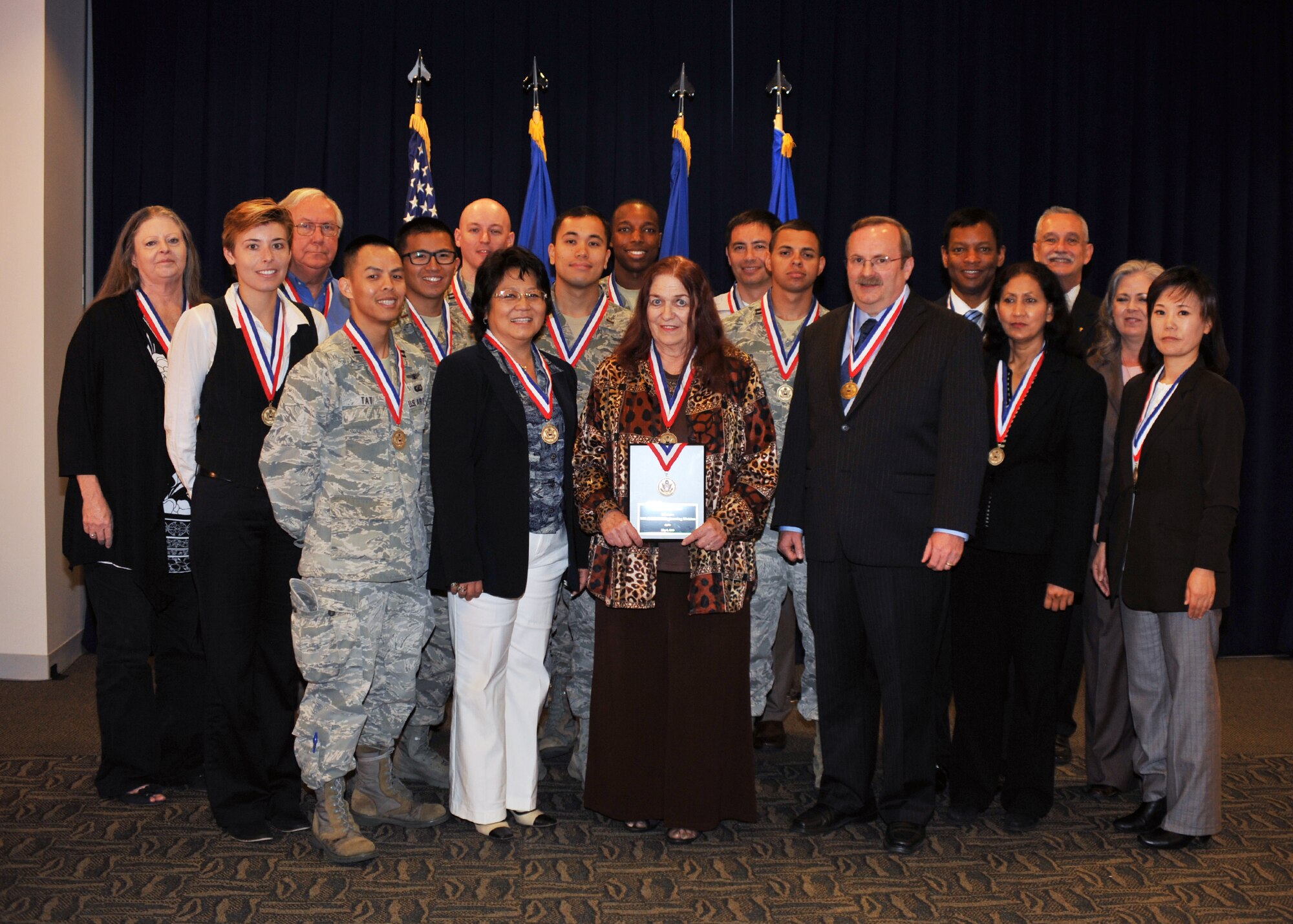 The Military Satellite Communications Engineering Division is recognized by the Federal Executive Board with a Partnership Award, May 8. The division was cited for its partnerships in providing communications for approximately 16,000 aircraft, ships, mobile and fixed sites. (Photo by Sarah Corrice)
