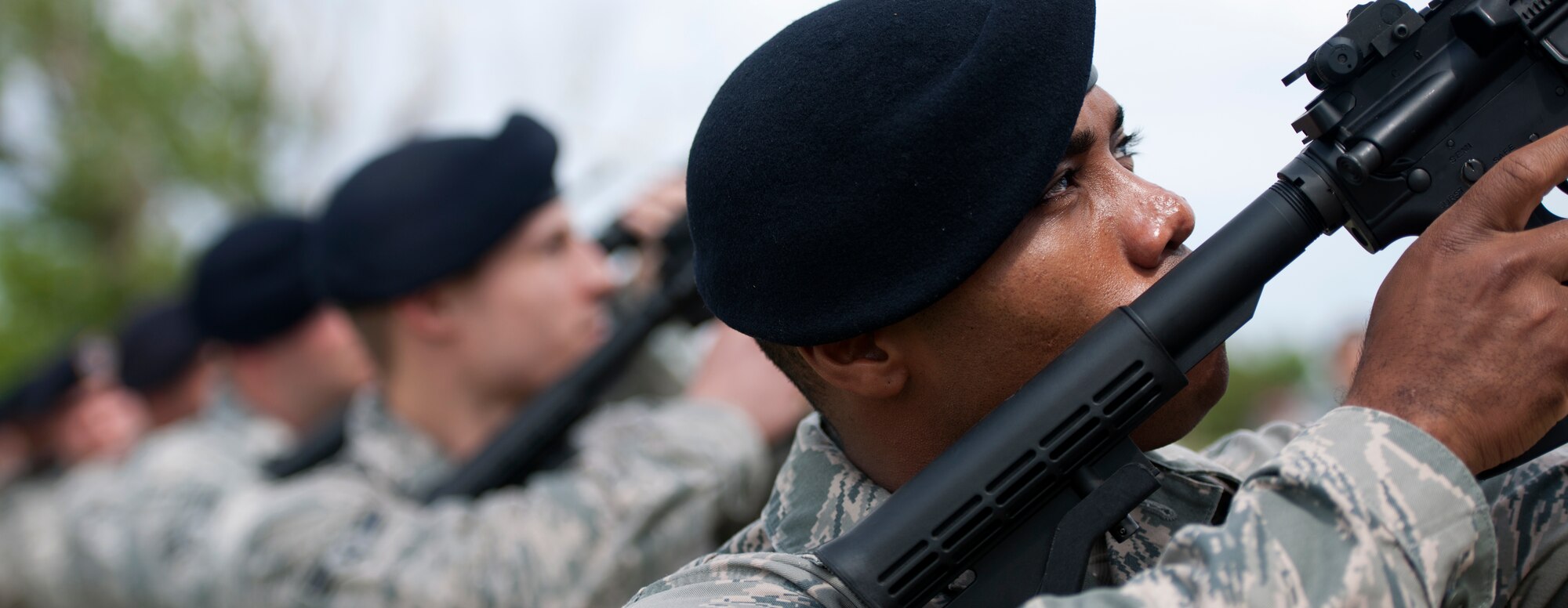 ALTUS AIR FORCE BASE, Okla. – Senior Airman Paul Palmer, 97th Security Forces Squadron patrolman, performs the 21-gun salute in observance of National Police Week at Wings of Freedom Park, May 15. Members of the 97th SFS honored law enforcement officers killed or disabled in the line of duty. Before retiring the wreath the 97th SFS performed a 21-gun salute and played Taps in remembrance of the fallen defenders. (U.S. Air Force photo by Senior Airman Jesse Lopez / Released)
