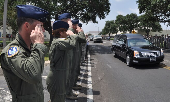As the vehicle carrying Capt. Mark Voss passes, pilots and boom operators from the 18th Air Refueling Squadron, McConnell Air Force Base, Kan., join with service members and civilians of the Joint Base San Antonio and San Antonio community as they line the streets to honor the fallen KC-135 Stratotanker pilot, May 16, 2013. 
Pictured (front to rear) are 1st Lt. Mike Warren, Chief Master Sgt. Kathleen Lowman, Tech. Sgt. Matthew Tener, Capt. Pete Haubein and Maj. Scott Meyer of the 18th ARS. 

Voss, of Boerne, Texas; Capt. Victoria A. Pinckney of Colorado Springs, Colo.; and Tech Sgt. Herman Mackey III of Bakersfield, Calif., were killed when their KC-135 Stratotanker crashed in northern Kyrgyzstan, May 3, 2013.  All were assigned to the 93rd Air Refueling Squadron at Fairchild AFB, Wash. (U.S. Air Force Photo by Master Sgt. Brannen Parrish)
 

