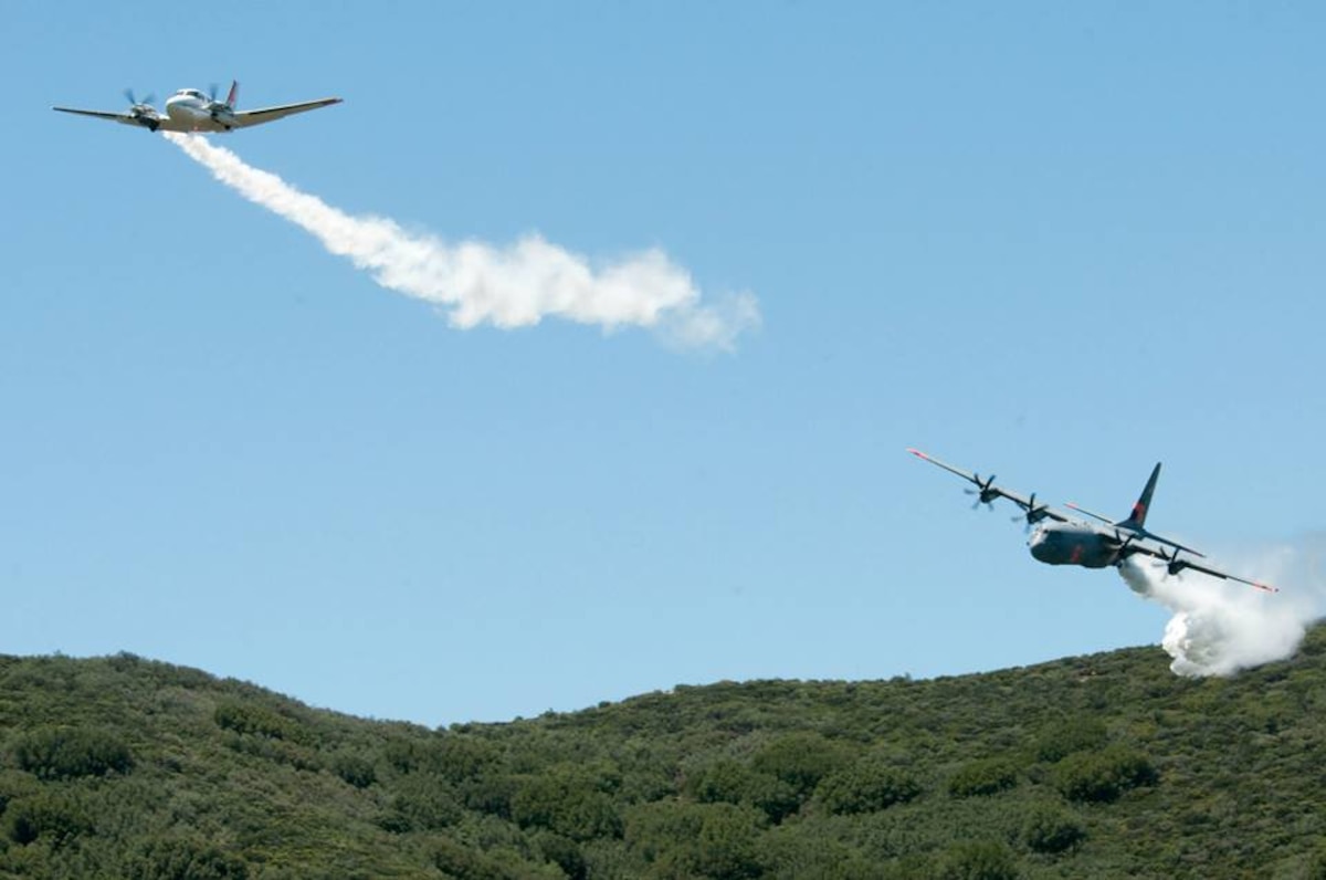 C-130J from the 146th Airlift Wing performs a water drop for training in the Angeles National Forest May 14, 2013. (U.S. Air National Guard photo by Senior Airman Nicholas Carzis).