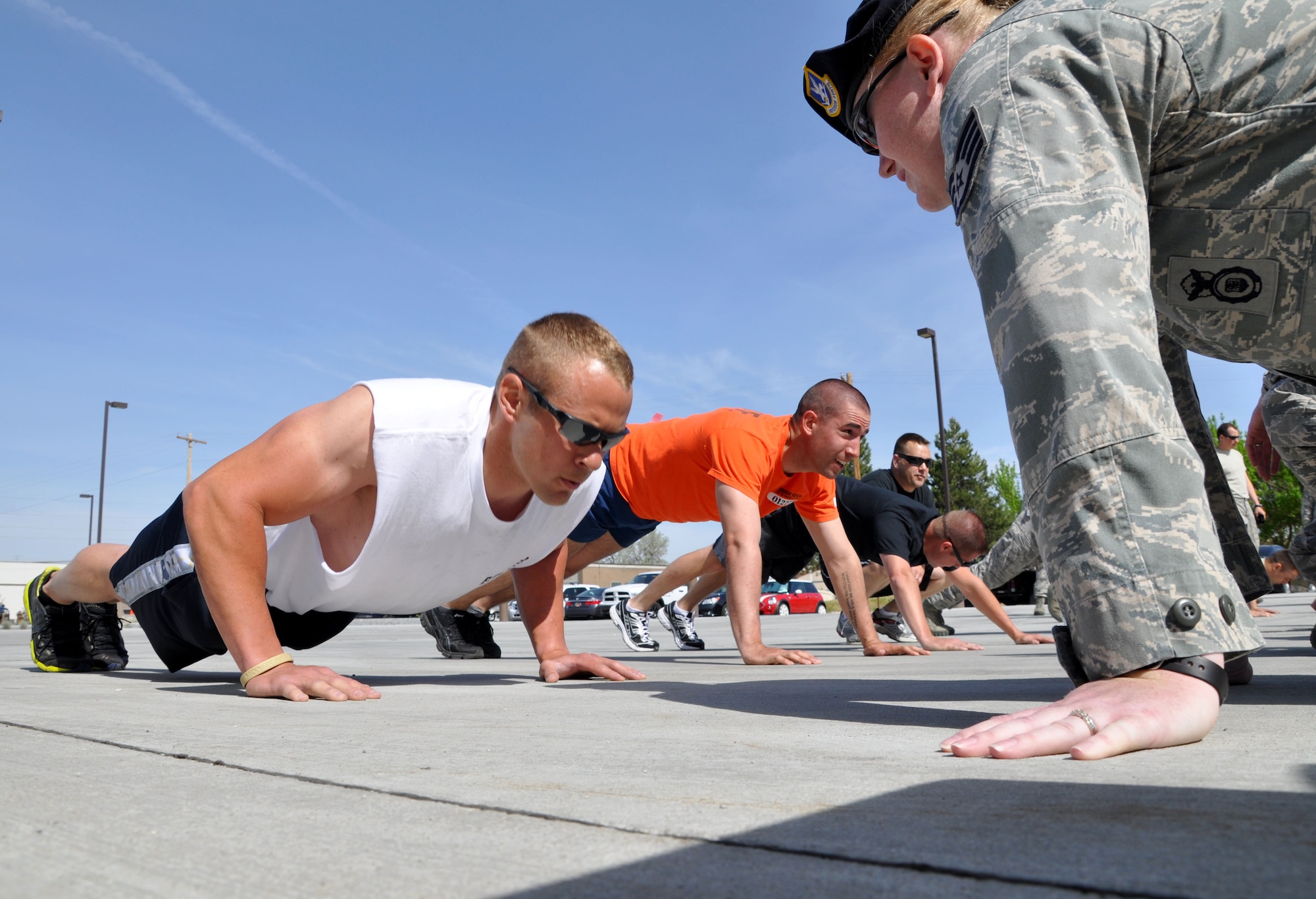 Staff Sgt. Nicholas Bricker, 419th Security Forces Squadron, does push-ups during the “Rock Hard Cop Physical Challenge” in support of National Police Week here today. Bricker took first place for his team in the timed event, completing 112 push-ups in two minutes. (U.S. Air Force photo/Bryan Magaña) 