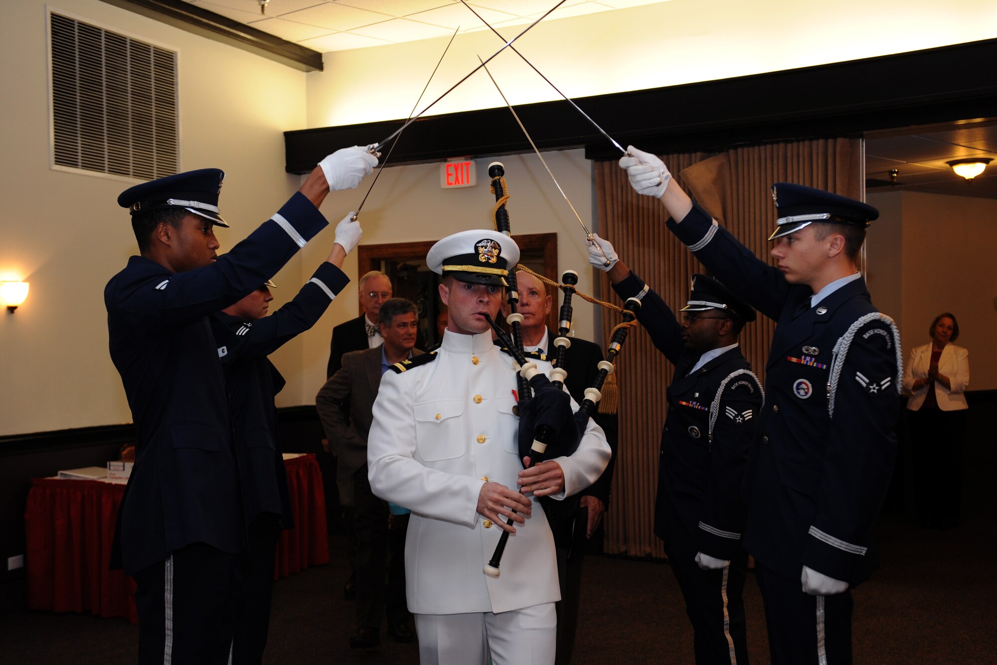 U.S. Navy Ensign Seth Barrow plays the bag pipe as the family of retired U.S. Army Command Sgt. Maj. Gary Littrell, Medal of Honor recipient, enters the Barksdale Club dining room on Barksdale Air Force Base, La., May 16, 2013. Littrell, sergeant first class at the time, received the Medal of Honor for his actions during the Vietnam War. Beginning with intense mortar attacks from the enemy, Littrell put himself in harm's way for days, repulsing the attacks and instilling his men with the will to resist. (U.S. Air Force photo/Airman 1st Class Benjamin Gonsier)
